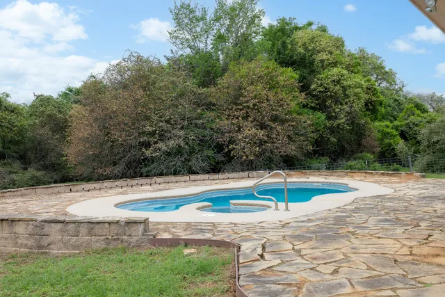 a view of a swimming pool with an outdoor space