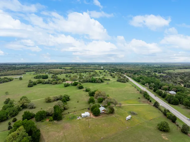 a view of a garden with an outdoor seating