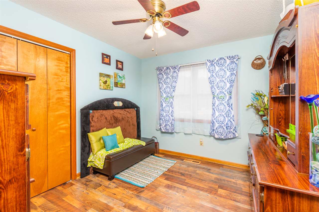 186 River Ridge Drive Verona, VA 24482 - Photo 38 of 50 a bedroom with a bed and a chandelier