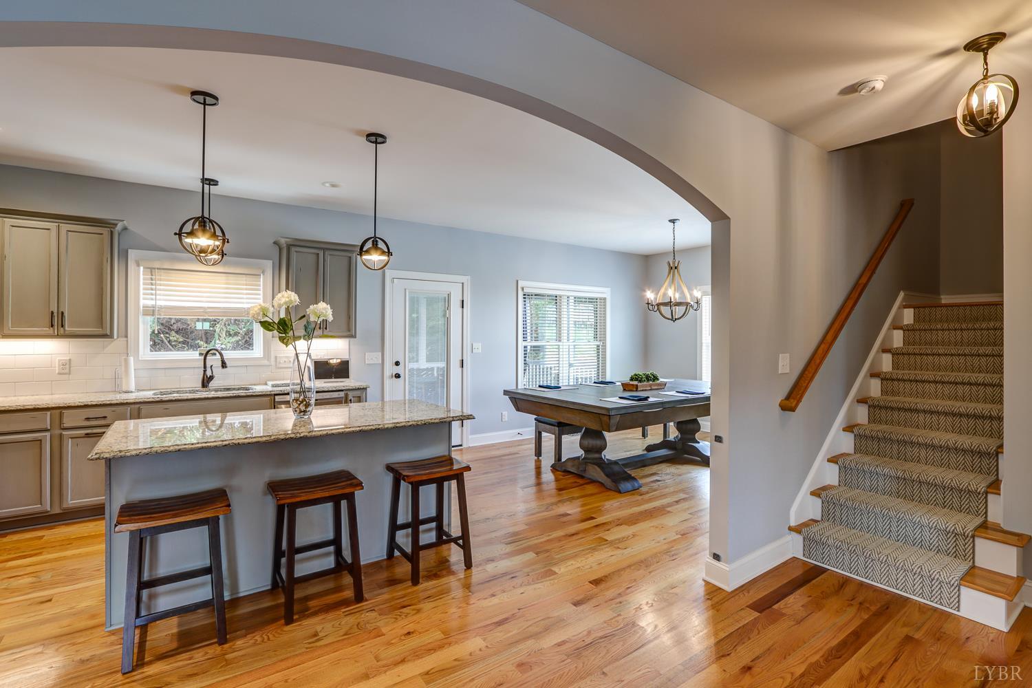 1013 Cobblestone Lane Forest, VA 24551 - Photo 12 of 49 a kitchen with granite countertop wooden floors and a view of living room