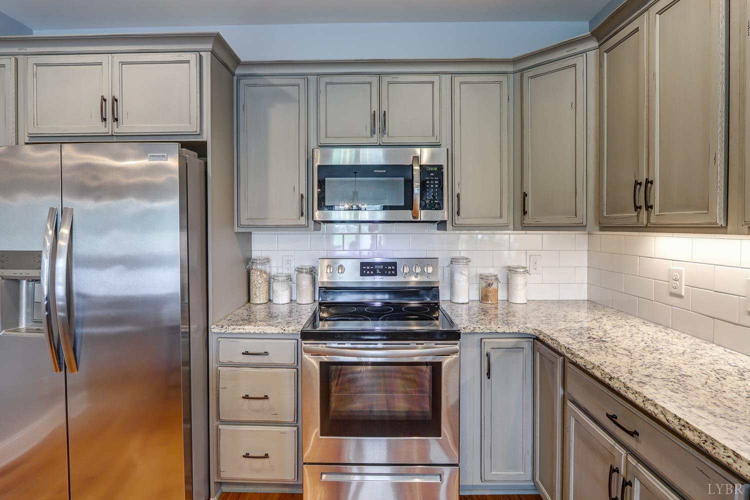 1013 Cobblestone Lane Forest, VA 24551 - Photo 18 of 49 a kitchen with a stove microwave and refrigerator