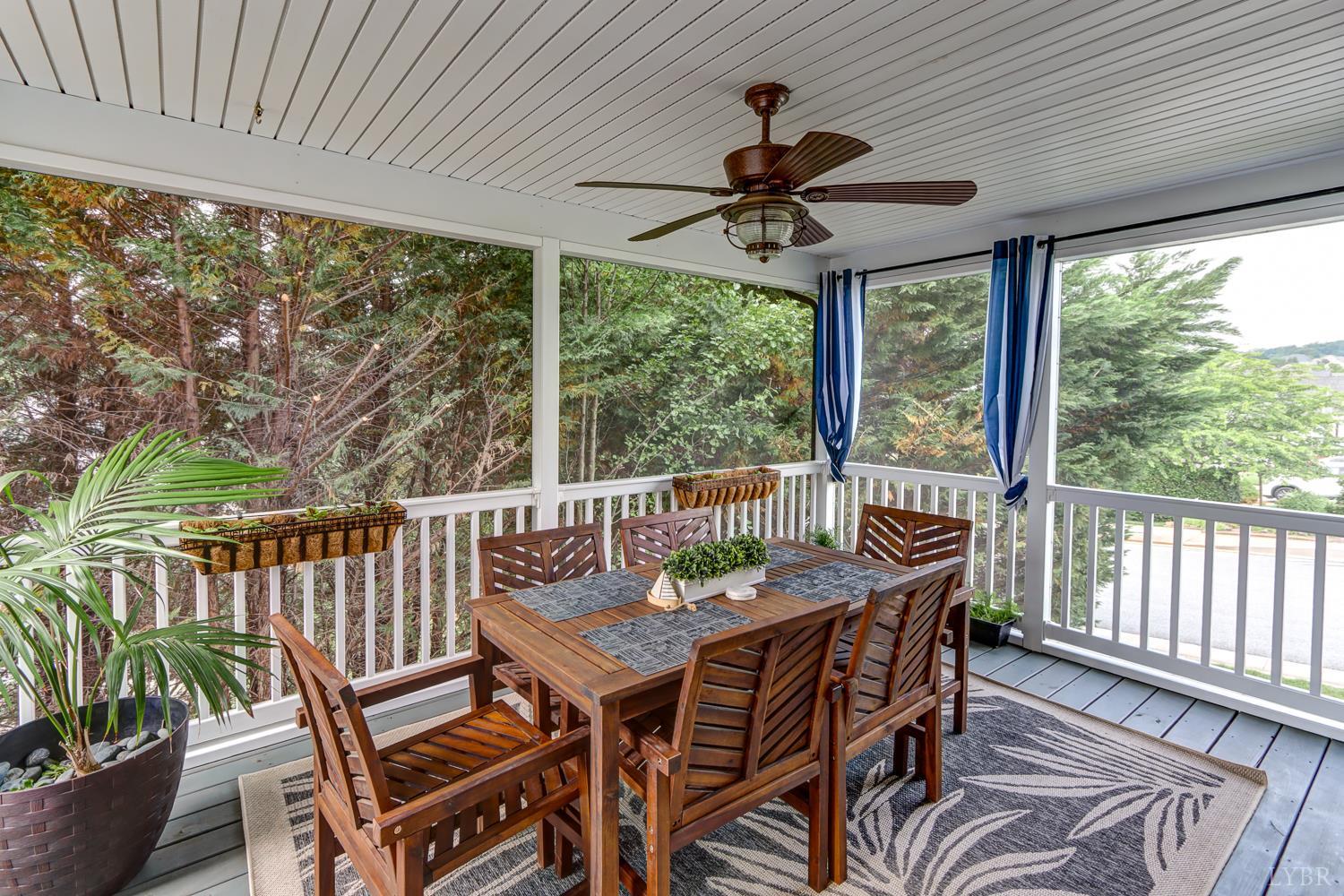 1013 Cobblestone Lane Forest, VA 24551 - Photo 21 of 49 a view of a patio with a table chairs and a backyard