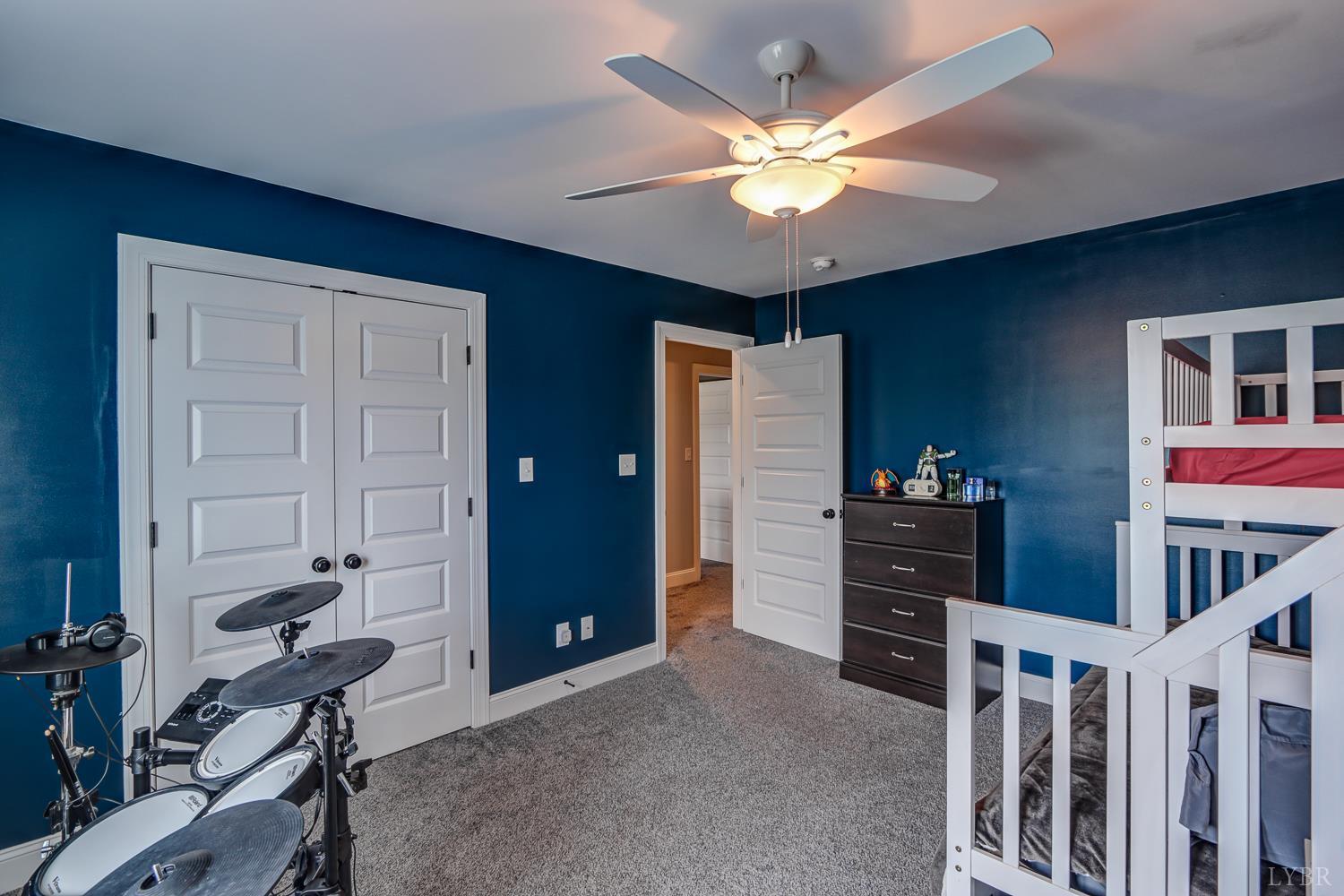 1013 Cobblestone Lane Forest, VA 24551 - Photo 26 of 49 a livingroom with furniture and a ceiling fan