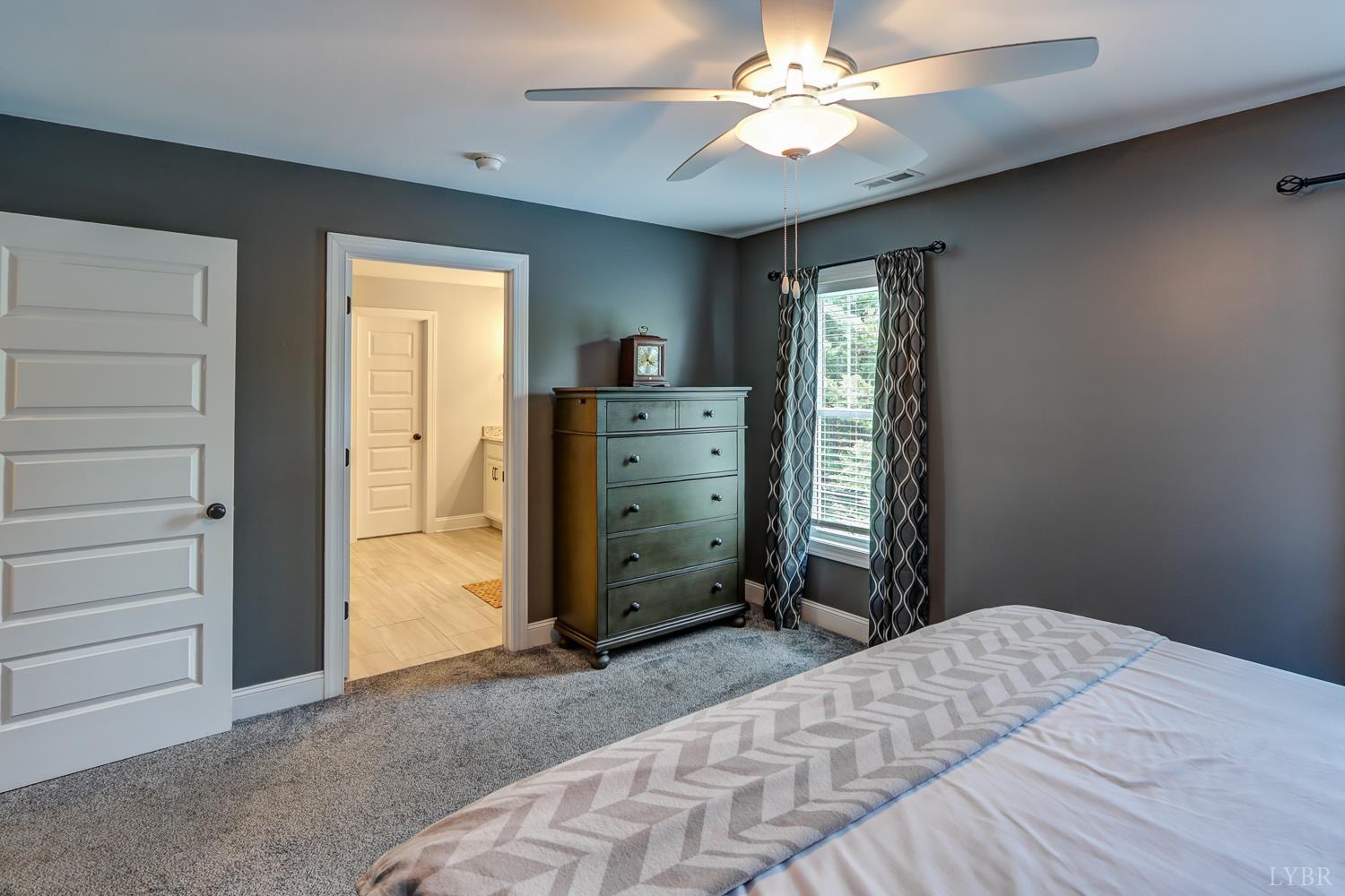 1013 Cobblestone Lane Forest, VA 24551 - Photo 34 of 49 a bedroom with a bed and a window