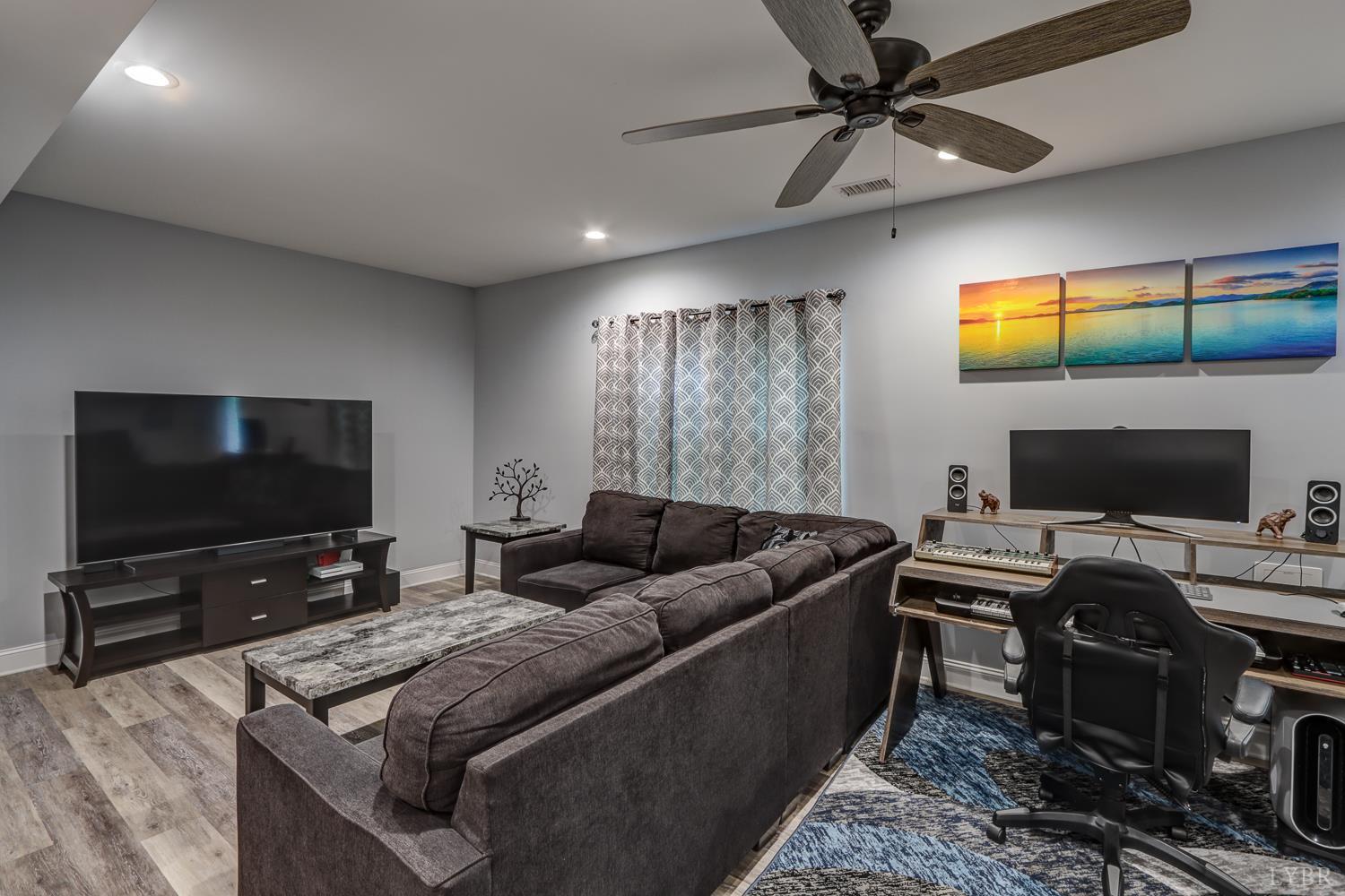 1013 Cobblestone Lane Forest, VA 24551 - Photo 40 of 49 a living room with furniture and a flat screen tv