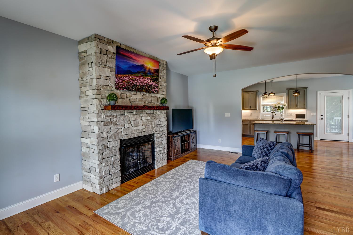 1013 Cobblestone Lane Forest, VA 24551 - Photo 4 of 49 a living room with furniture and a fireplace