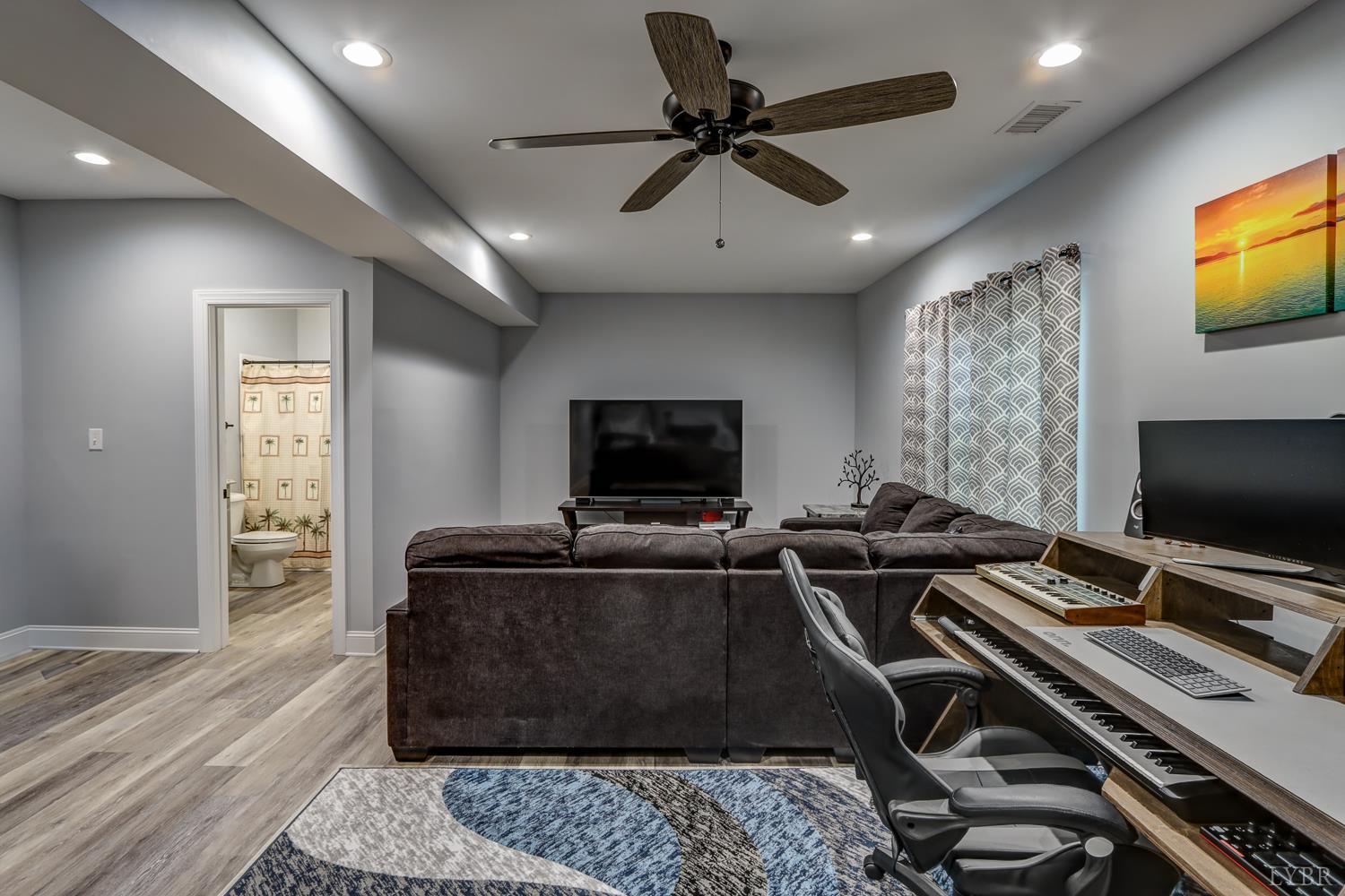 1013 Cobblestone Lane Forest, VA 24551 - Photo 43 of 49 a living room with furniture and a flat screen tv