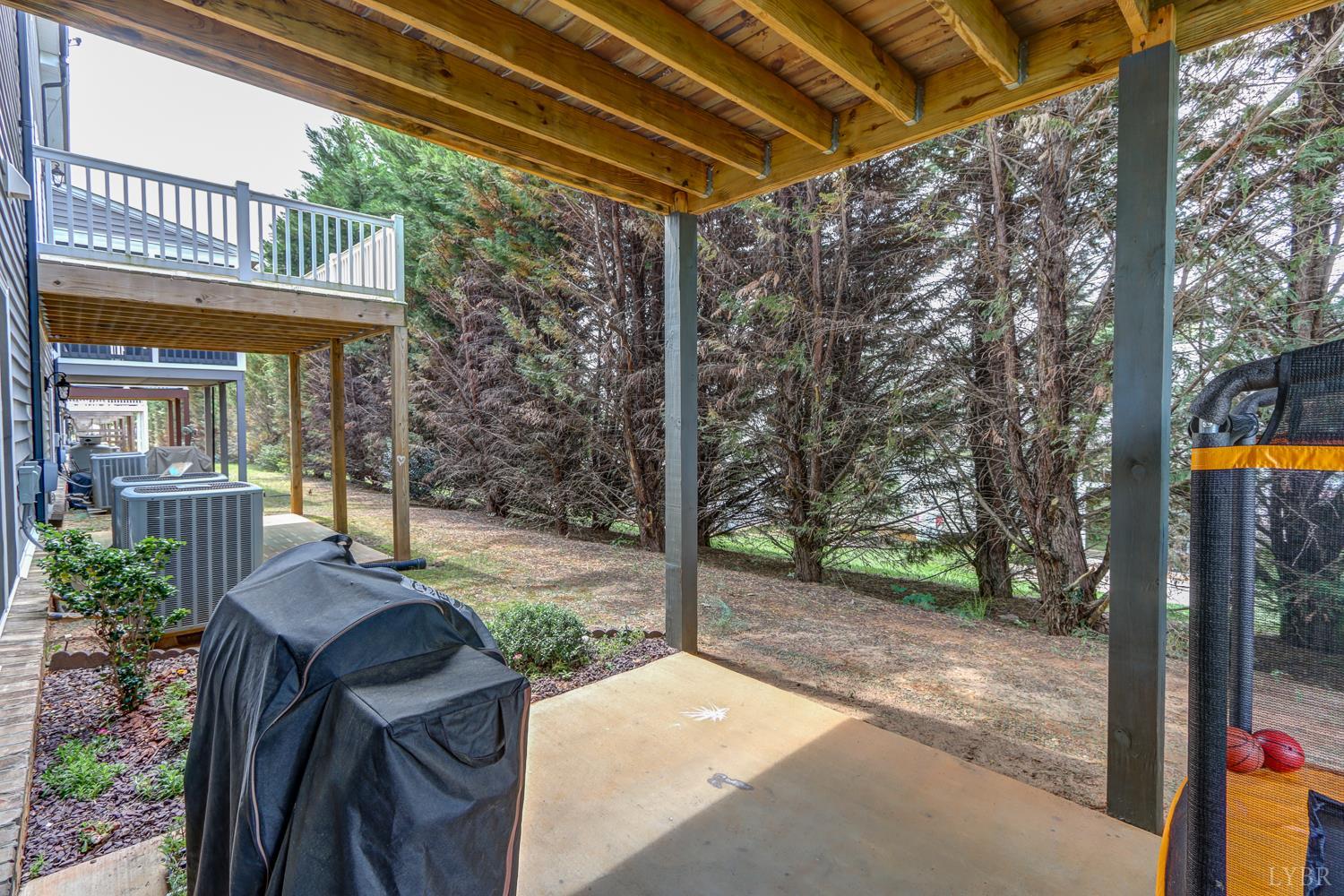 1013 Cobblestone Lane Forest, VA 24551 - Photo 44 of 49 a view of a patio with table and chairs and potted plants