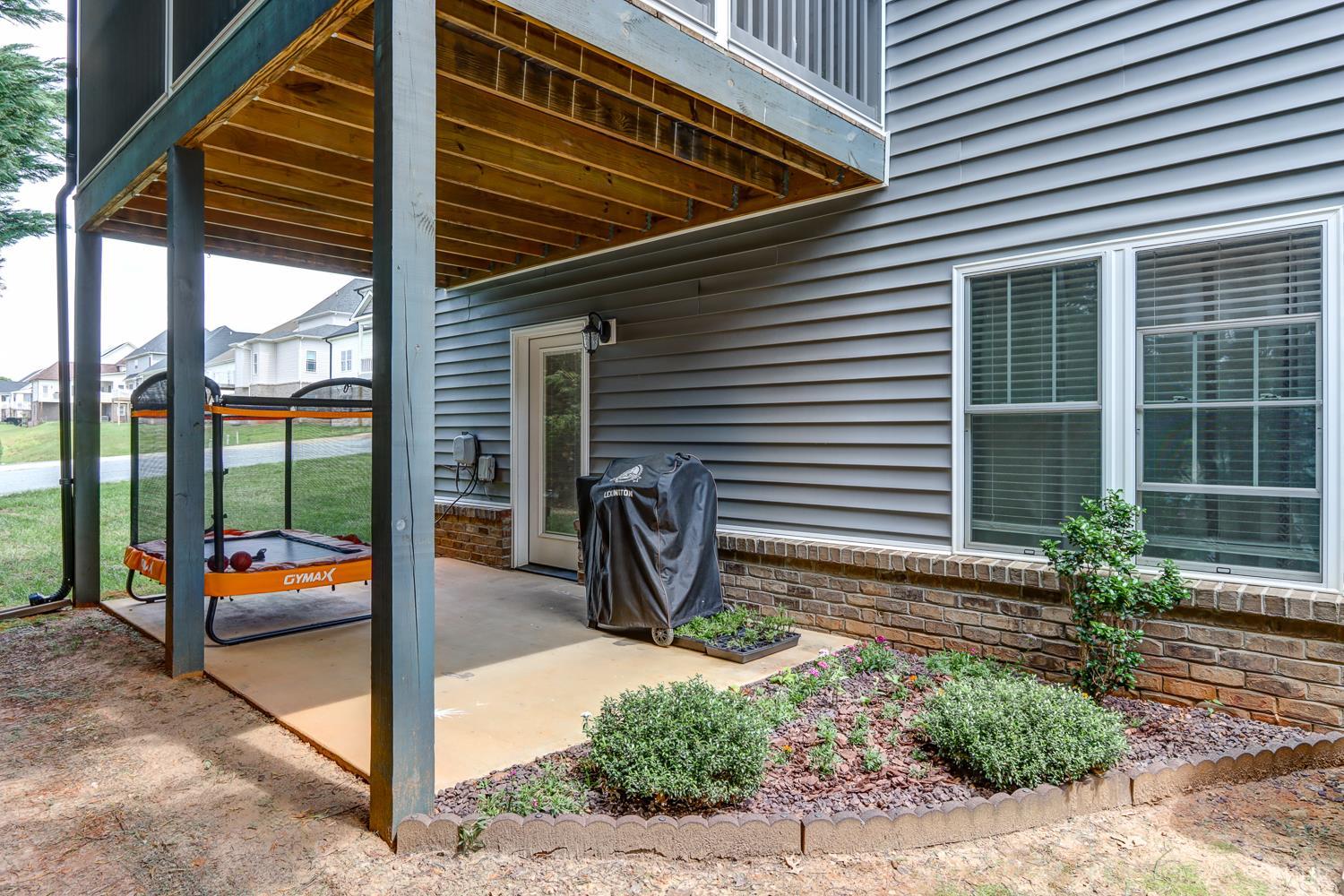 1013 Cobblestone Lane Forest, VA 24551 - Photo 47 of 49 a view of a patio with table and chairs and potted plants