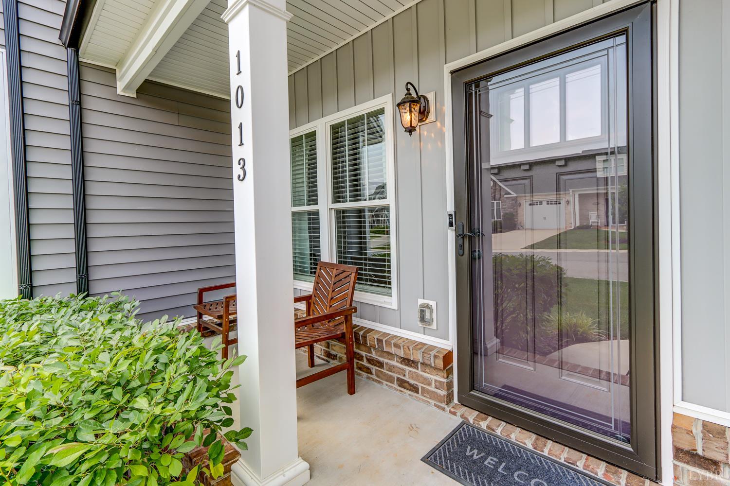 1013 Cobblestone Lane Forest, VA 24551 - Photo 49 of 49 a balcony with table and chairs and potted plants