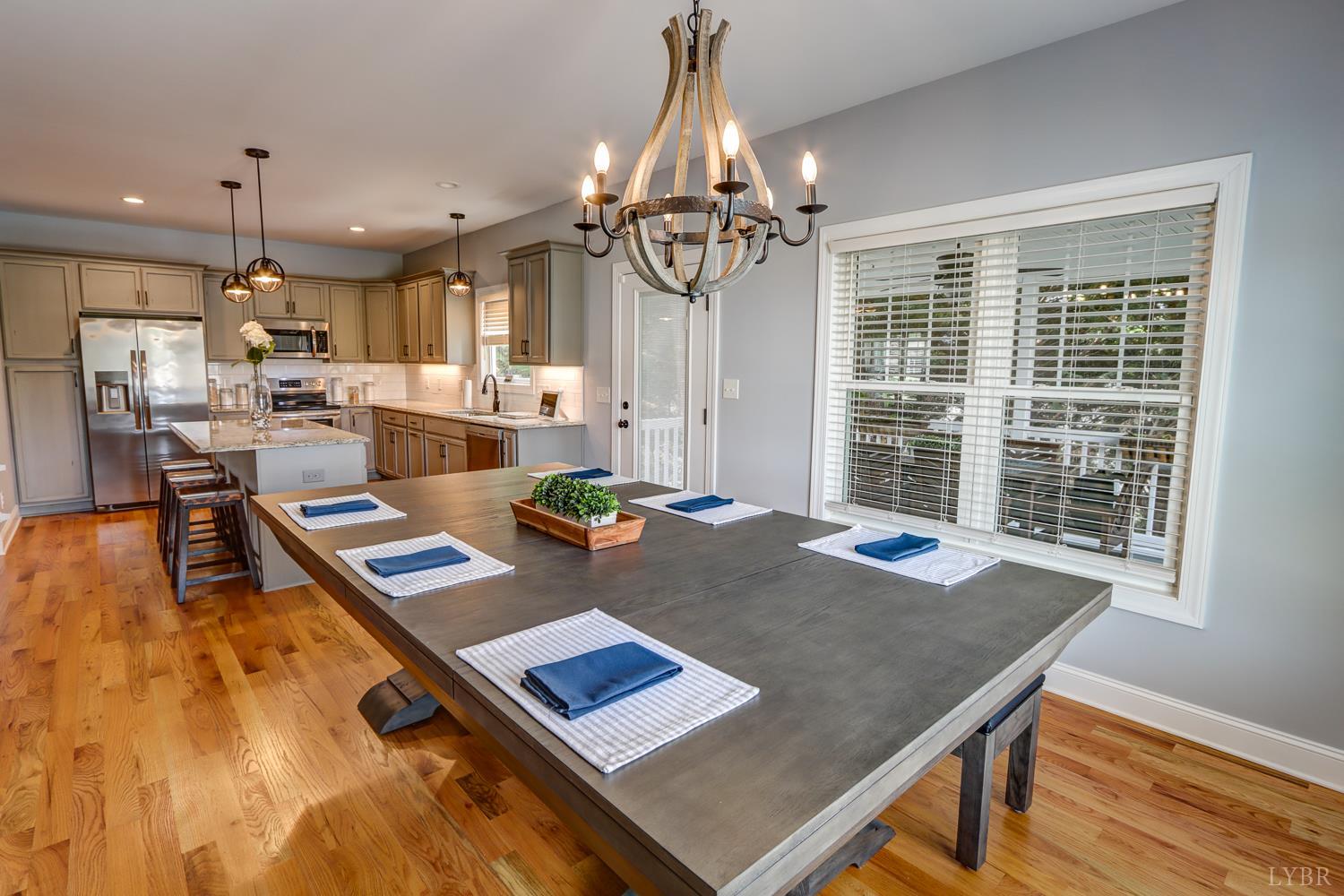 1013 Cobblestone Lane Forest, VA 24551 - Photo 5 of 49 a view of a dining room with furniture window and wooden floor