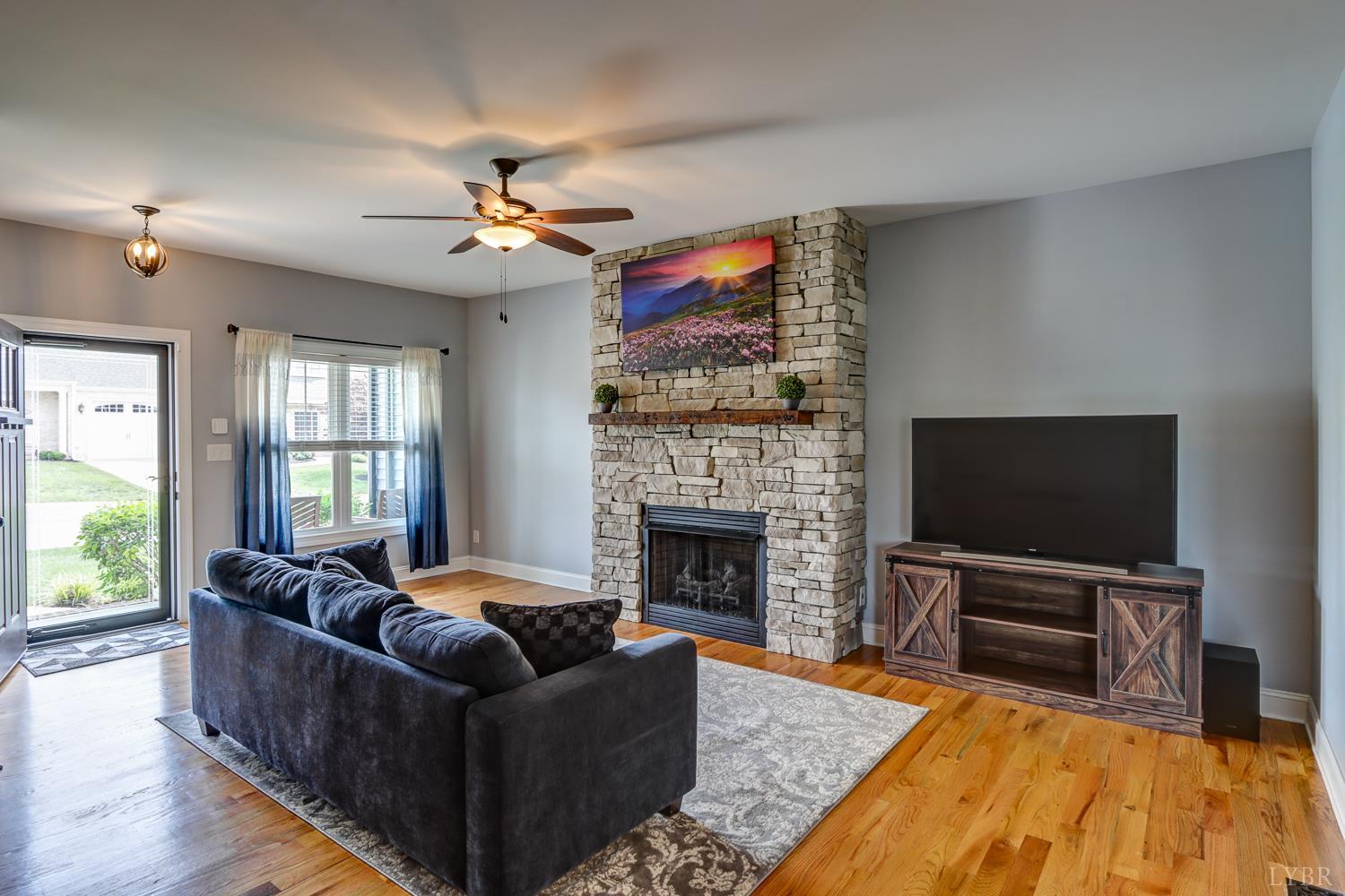 1013 Cobblestone Lane Forest, VA 24551 - Photo 8 of 49 a living room with furniture fireplace and flat screen tv