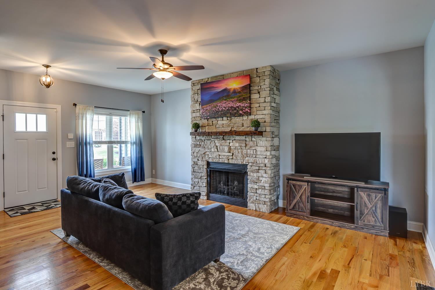 1013 Cobblestone Lane Forest, VA 24551 - Photo 9 of 49 a living room with furniture and a flat screen tv