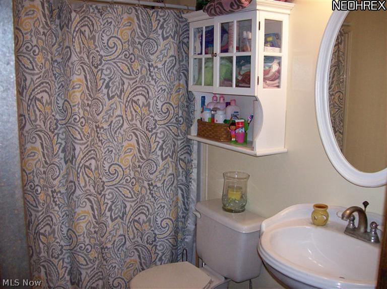 8245 Ruff Road West Salem, OH 44287 - Photo 14 of 25 Main bathroom off hallway. Bath floor retiled 2012. Bathroom vanity replaced 2011.