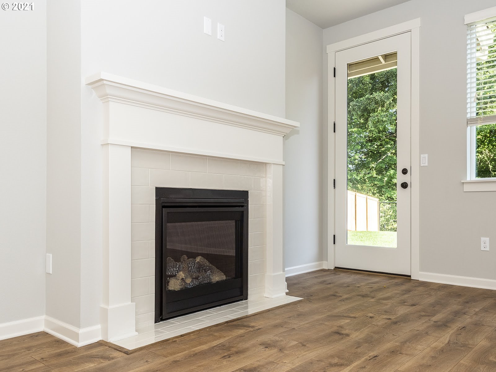 3736 South 42nd Place Ridgefield, WA 98642 - Photo 11 of 31 a view of an empty room with wooden floor and a window