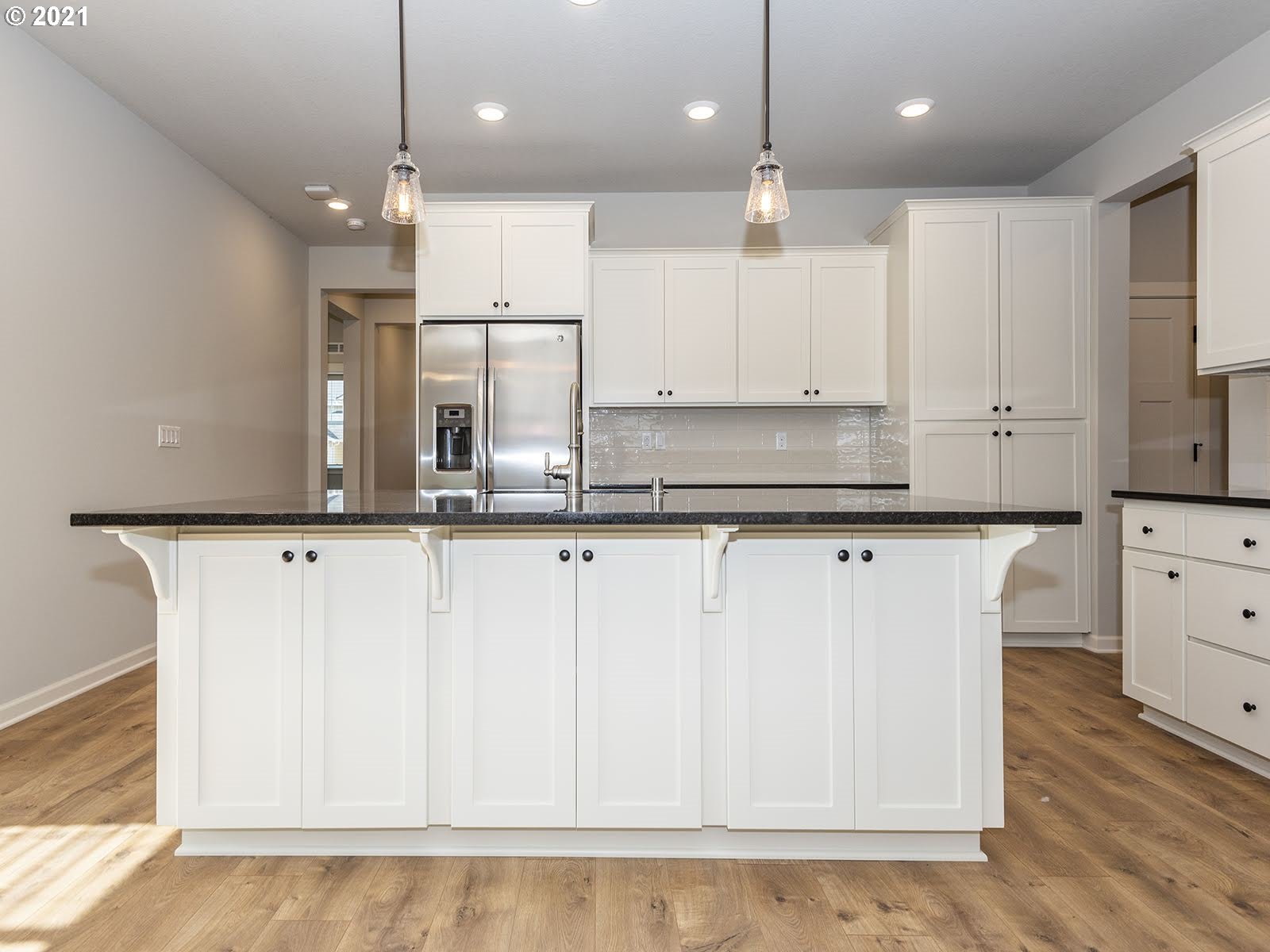 3736 South 42nd Place Ridgefield, WA 98642 - Photo 12 of 31 a view of kitchen with stainless steel appliances granite countertop cabinets and wooden floor