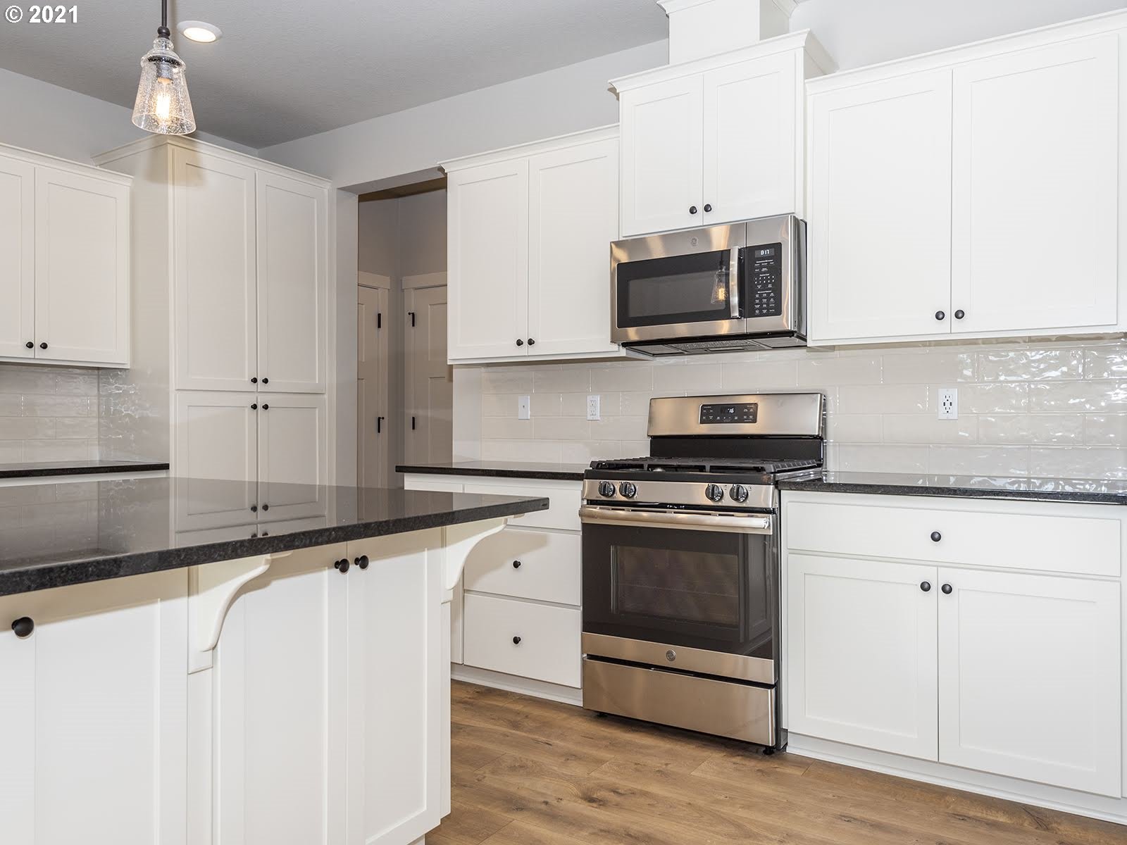 3736 South 42nd Place Ridgefield, WA 98642 - Photo 15 of 31 a kitchen with stainless steel appliances granite countertop a sink and a stove