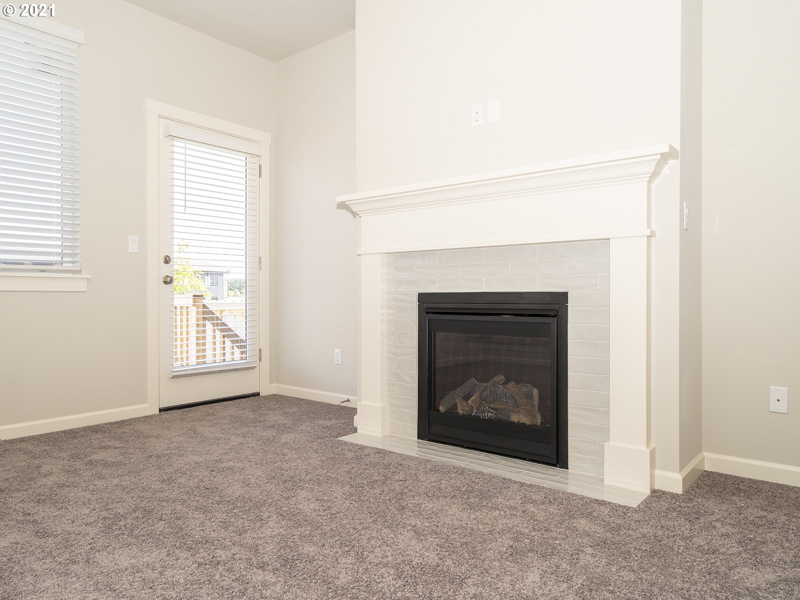 3736 South 42nd Place Ridgefield, WA 98642 - Photo 28 of 31 a living room with a fireplace and a window