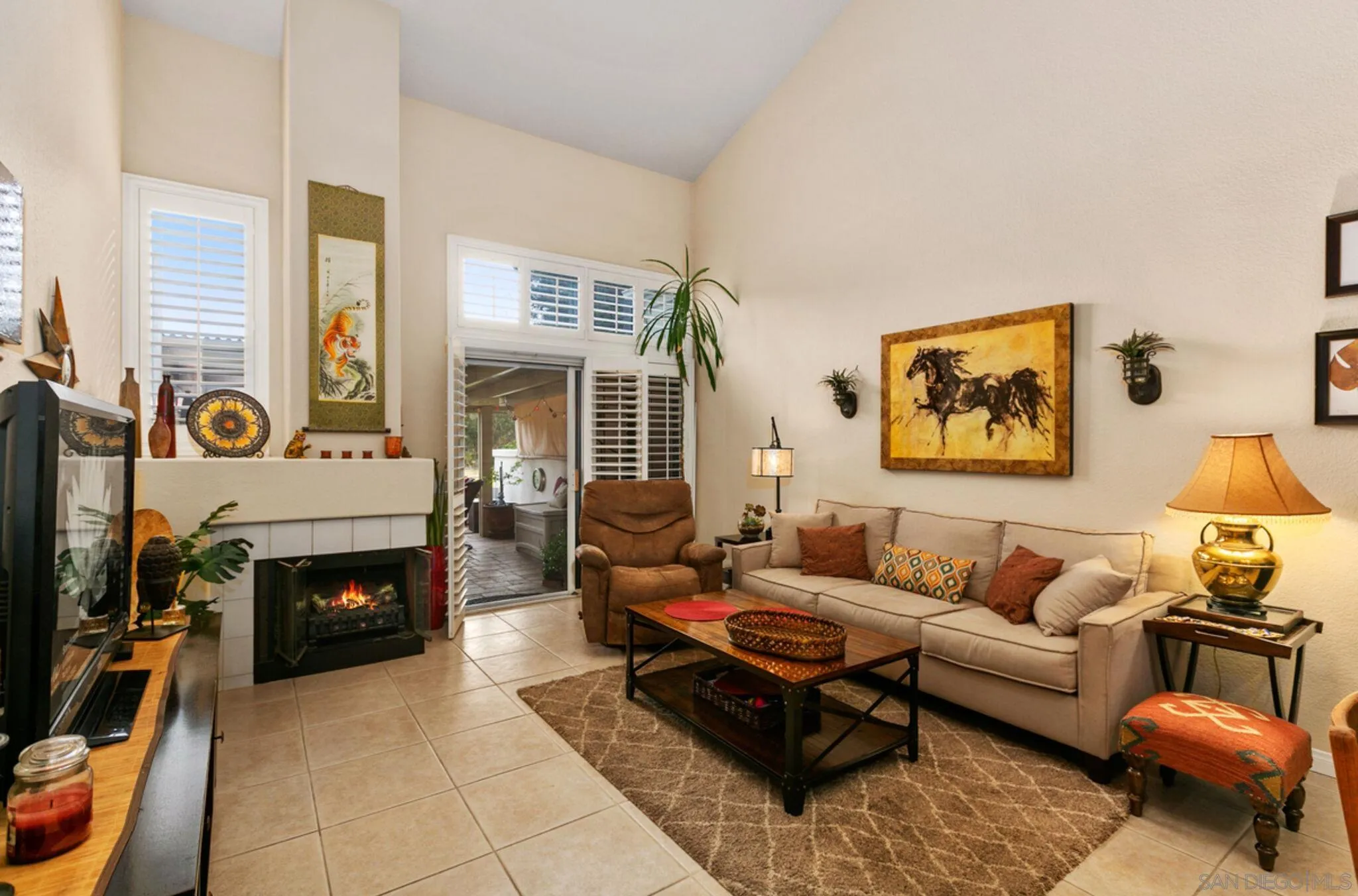 9018 Circle R Oaks Lane Escondido, CA 92026 - Photo 13 of 34 a living room with furniture and a fireplace