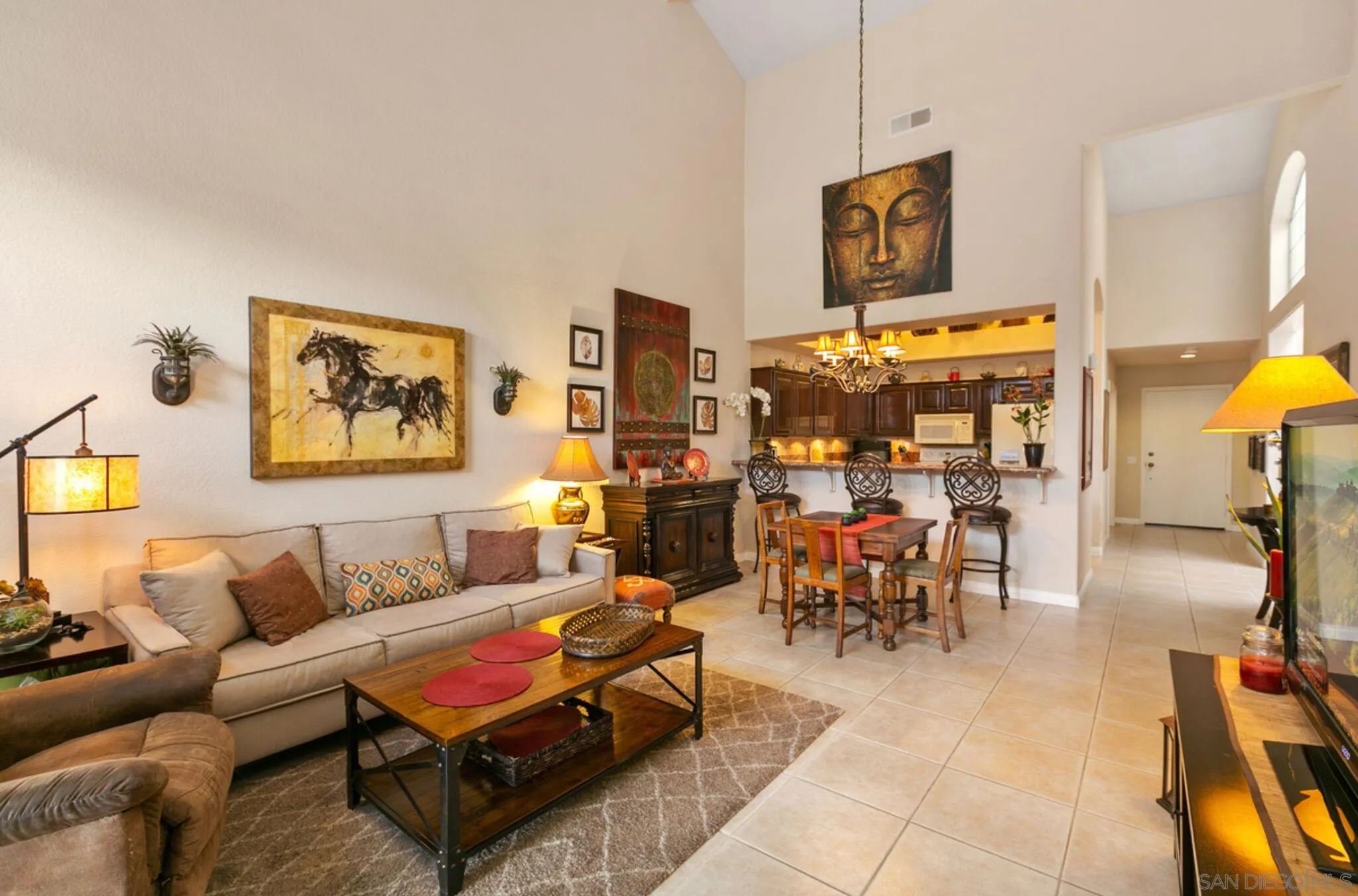 9018 Circle R Oaks Lane Escondido, CA 92026 - Photo 15 of 34 a living room with furniture a rug and a lamp