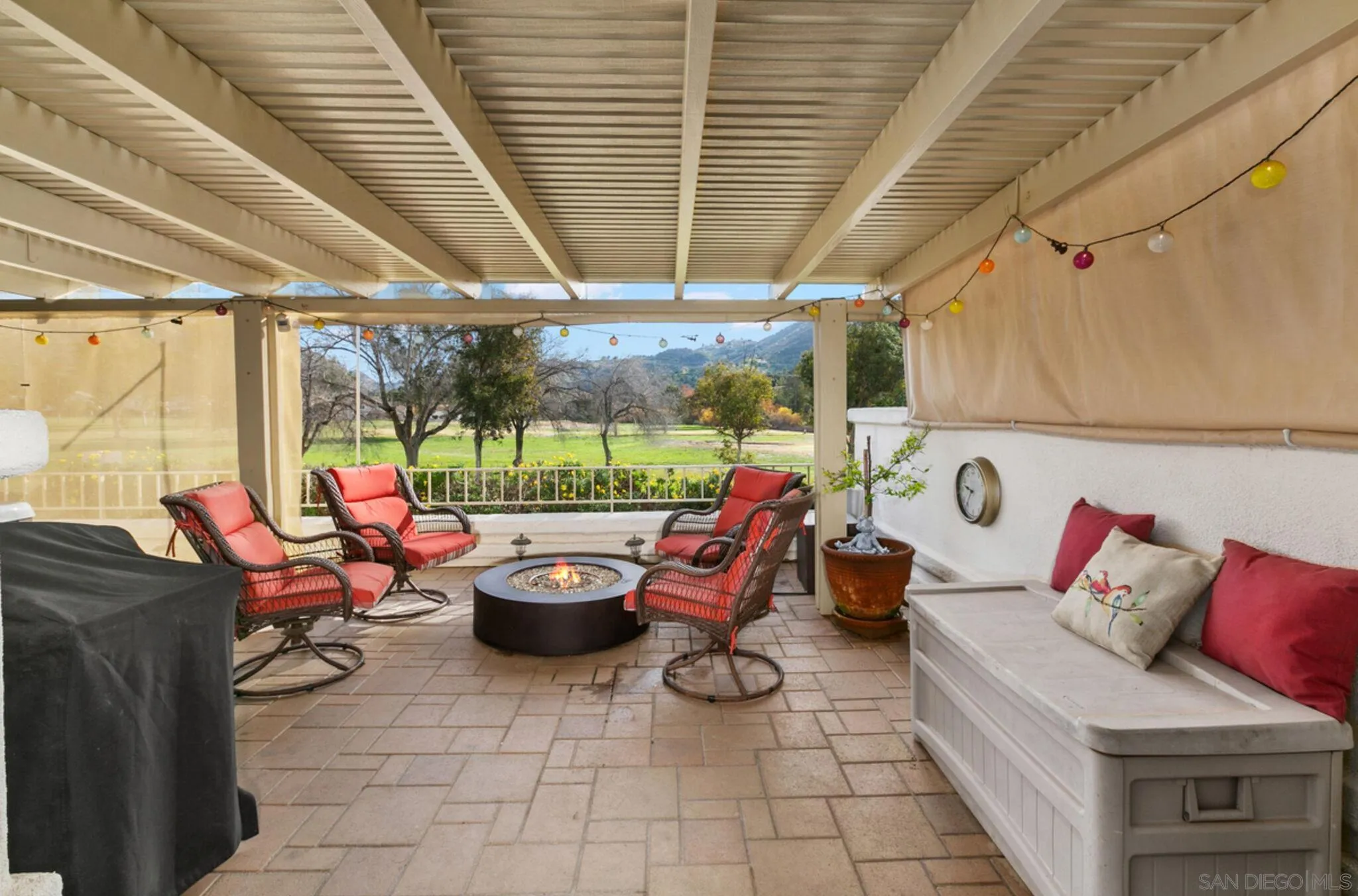 9018 Circle R Oaks Lane Escondido, CA 92026 - Photo 2 of 34 a view of a patio with table and chairs potted plants with wooden floor