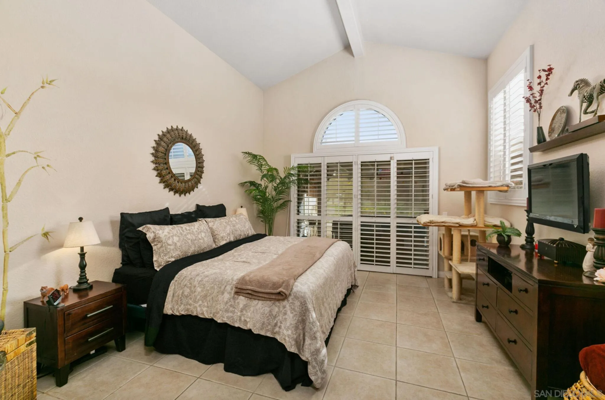 9018 Circle R Oaks Lane Escondido, CA 92026 - Photo 23 of 34 a bedroom with a bed and a flat tv screen on the dresser