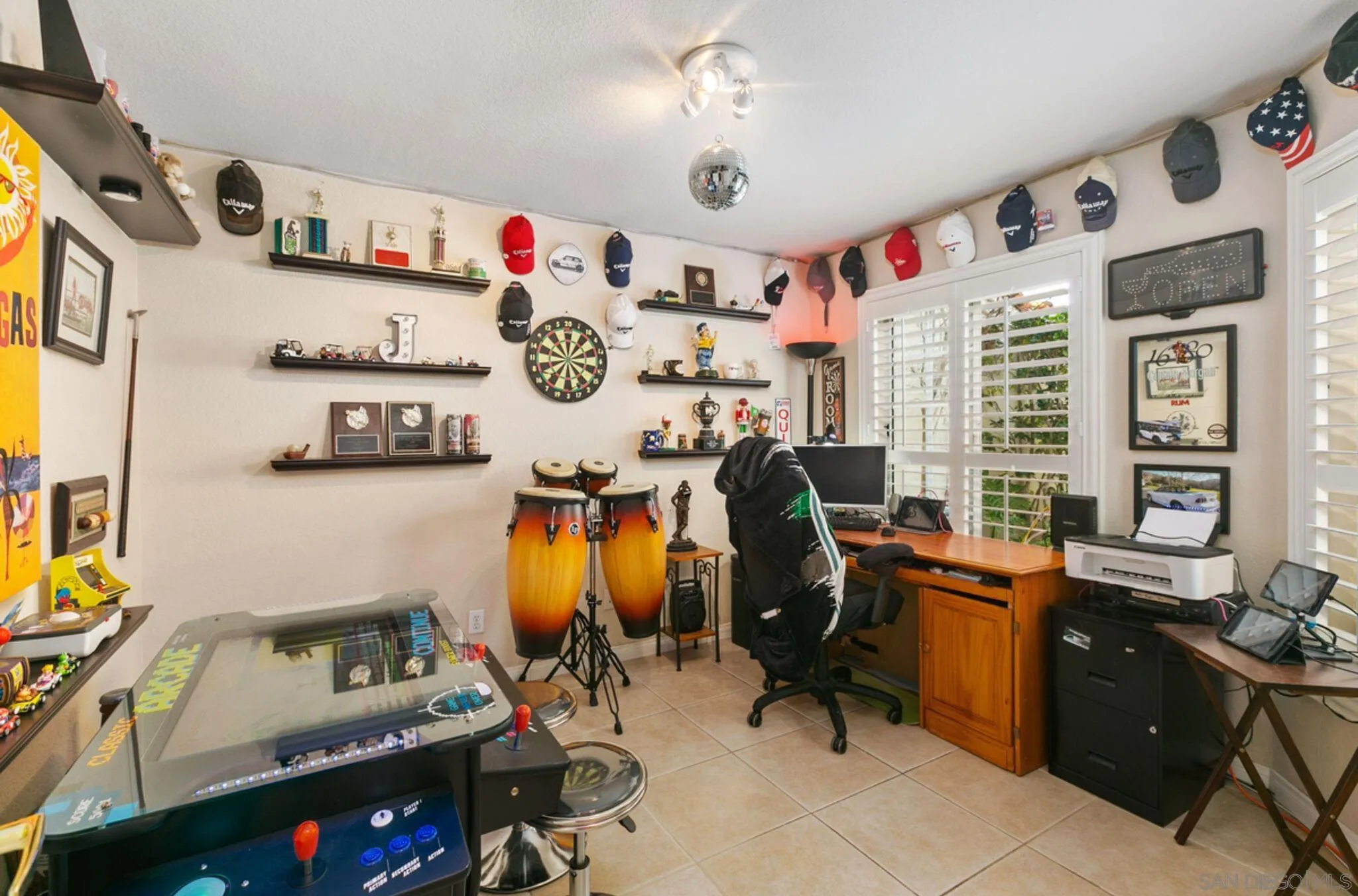 9018 Circle R Oaks Lane Escondido, CA 92026 - Photo 28 of 34 a view of a workspace with furniture and a window