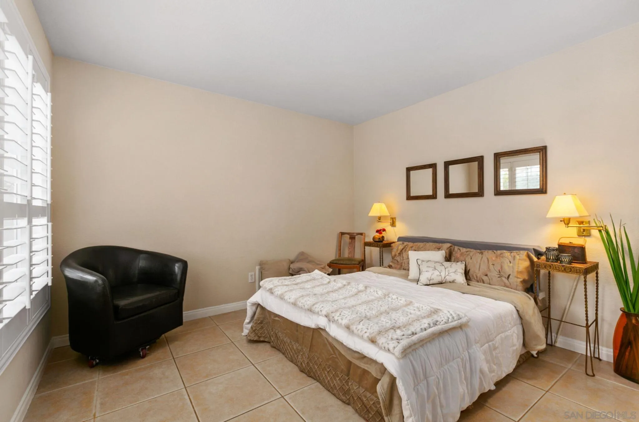 9018 Circle R Oaks Lane Escondido, CA 92026 - Photo 29 of 34 a bedroom with a bed and a chair