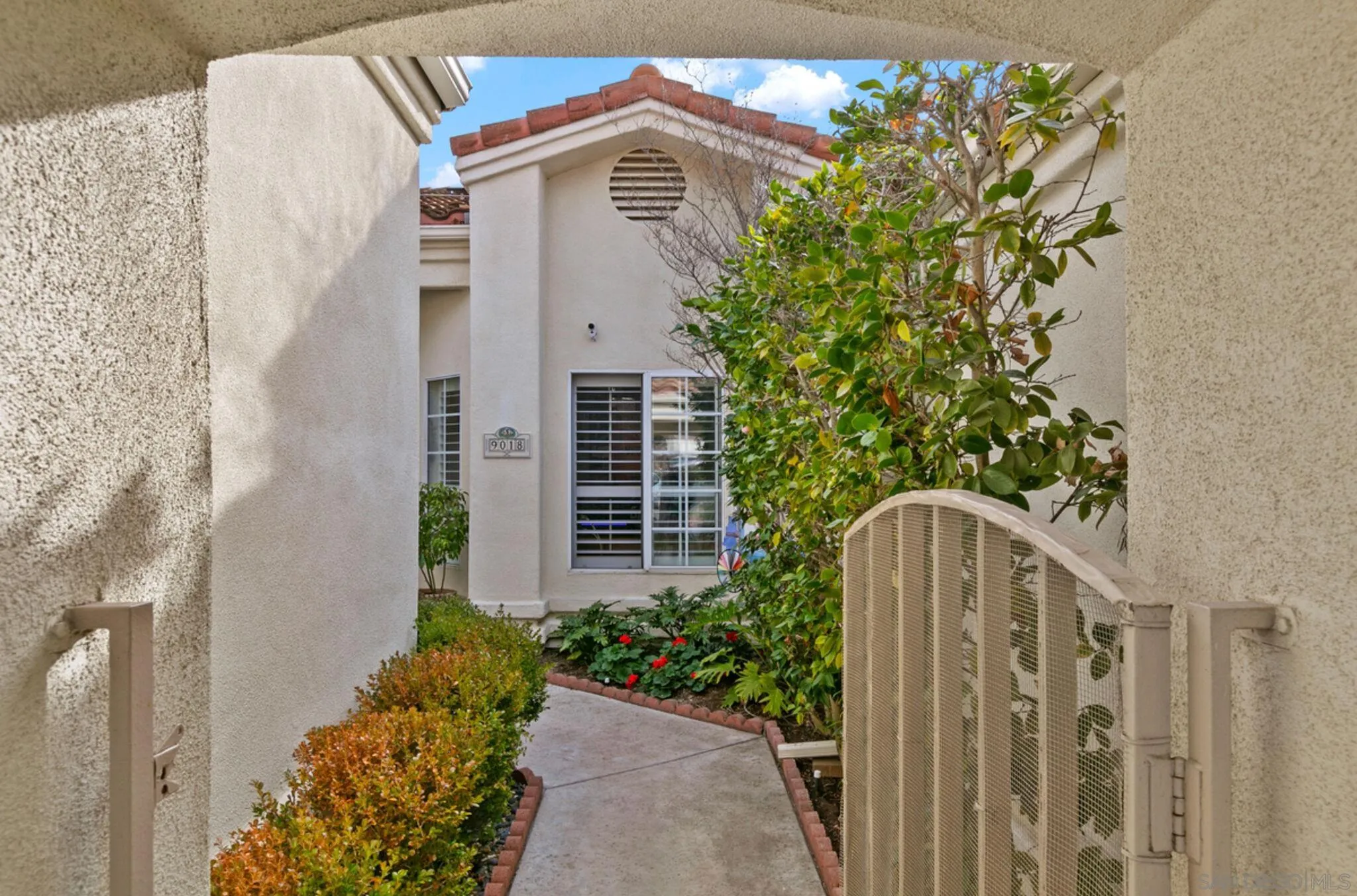 9018 Circle R Oaks Lane Escondido, CA 92026 - Photo 9 of 34 a front view of a house with a yard