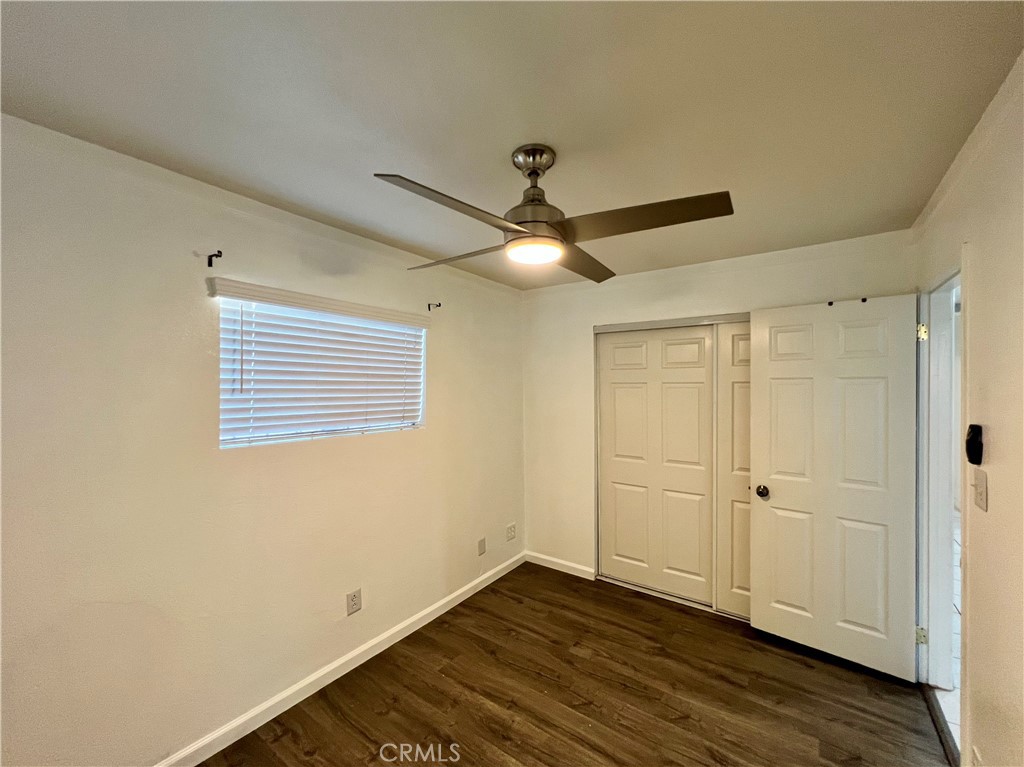 9329 Elizabeth Avenue South Gate, CA 90280 - Photo 5 of 8 a view of an empty room with wooden floor