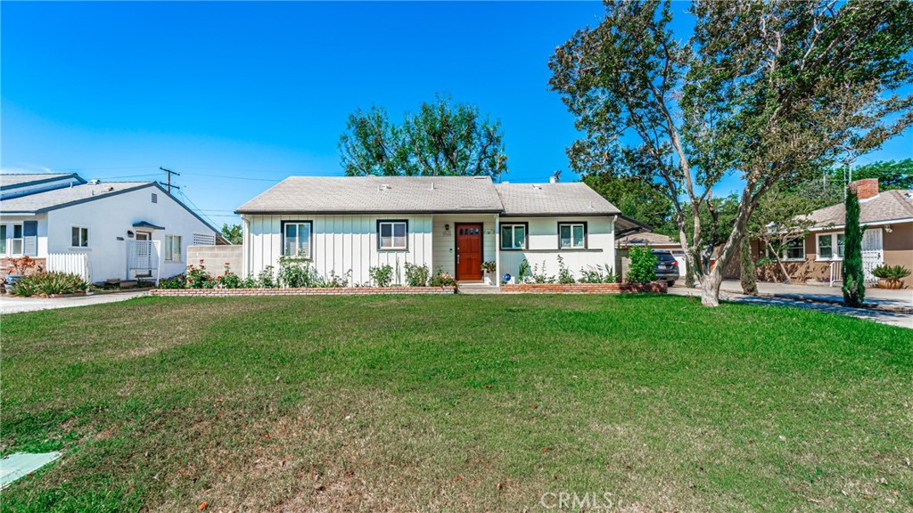 3908 San Marcos Avenue Riverside, CA 92504 - Photo 1 of 1 a front view of a house with a garden