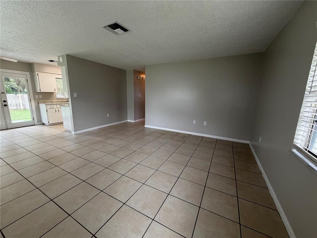 1405 Crystal Court, Unit C Tavares, FL 32778 - Photo 5 of 15 a view of an empty room and window