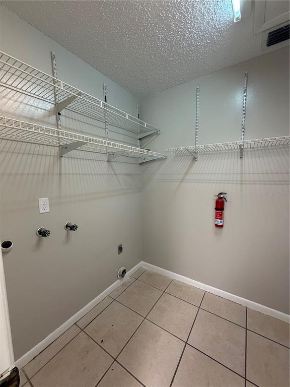 1405 Crystal Court, Unit C Tavares, FL 32778 - Photo 8 of 15 a view of storage and utility room with racks on the wall