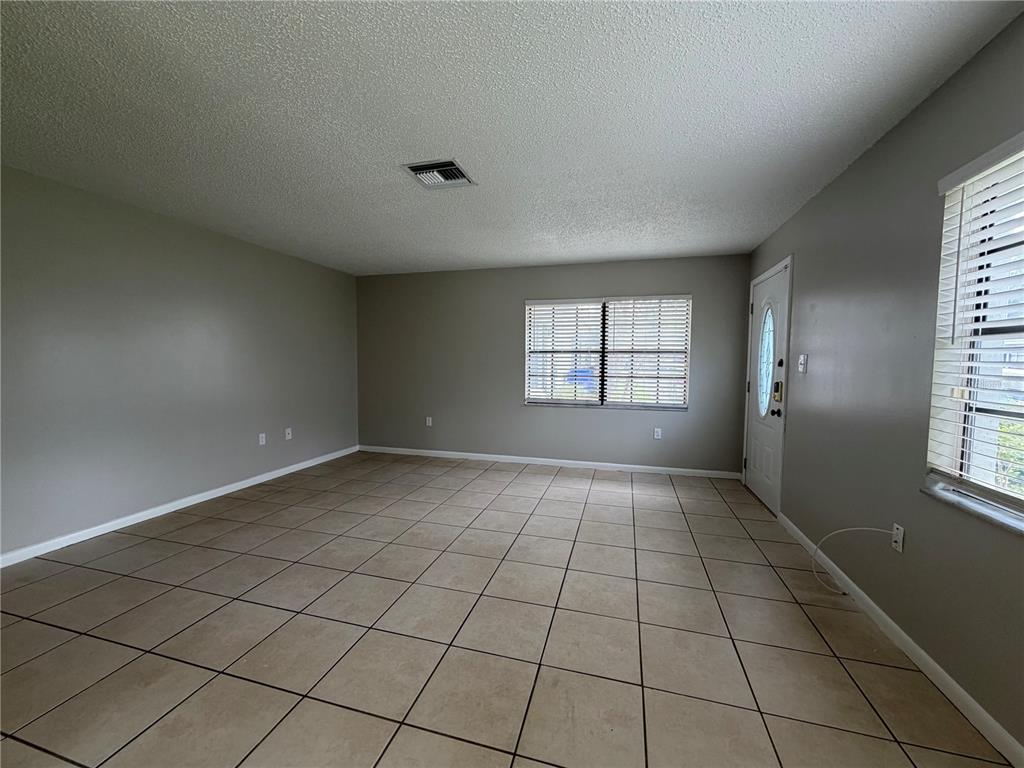 1405 Crystal Court, Unit C Tavares, FL 32778 - Photo 10 of 15 a view of an empty room and window