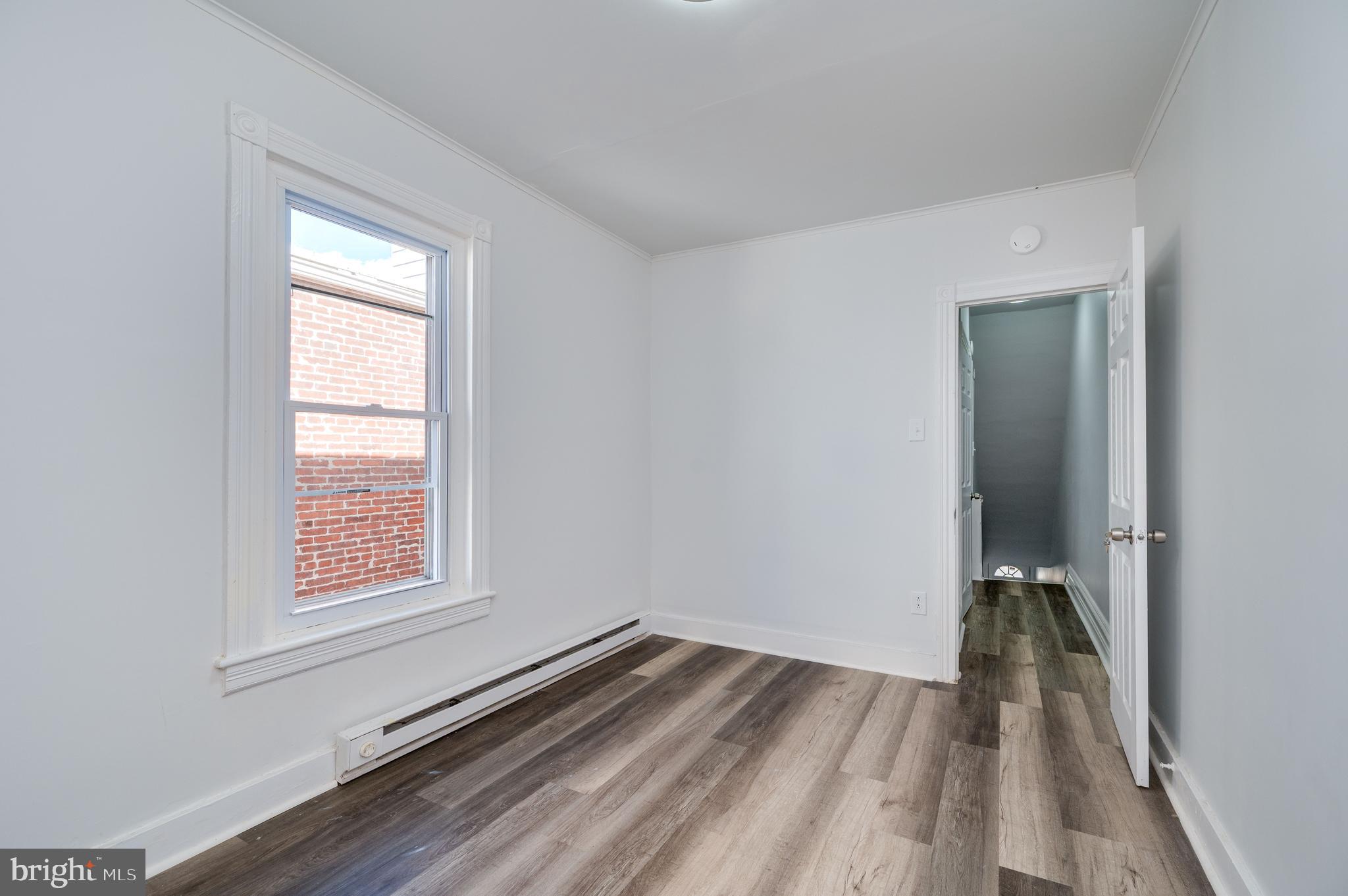 2024 Kutztown Road Reading, PA 19605 - Photo 18 of 38 wooden floor in an empty room with a window