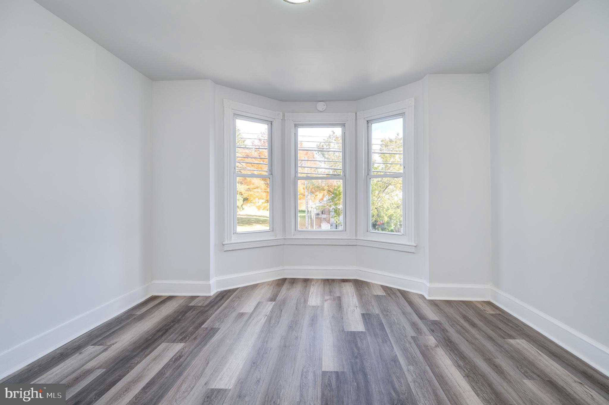 2024 Kutztown Road Reading, PA 19605 - Photo 22 of 38 wooden floor in an empty room with a window
