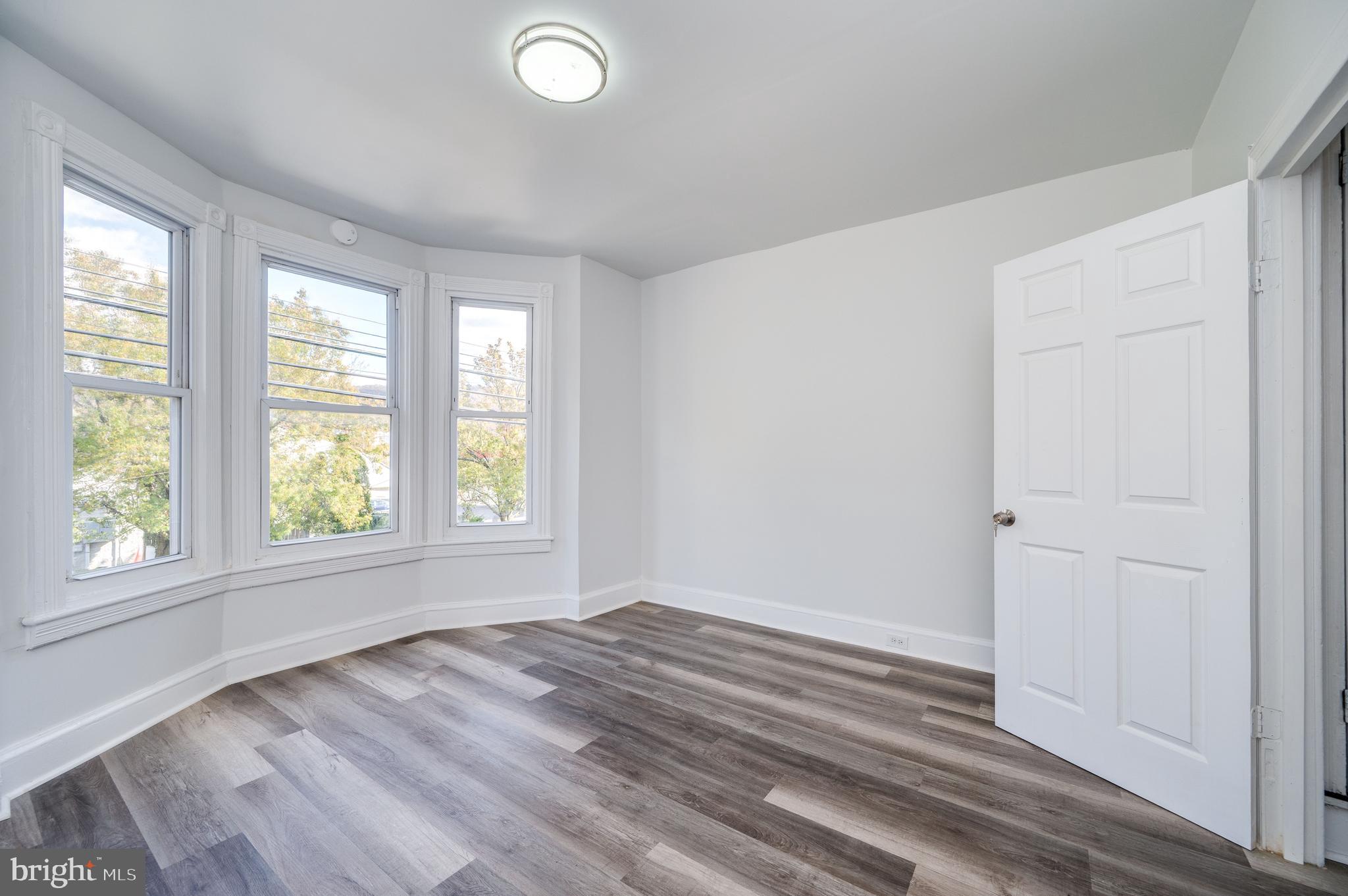 2024 Kutztown Road Reading, PA 19605 - Photo 23 of 38 a view of empty room with wooden floor and fan