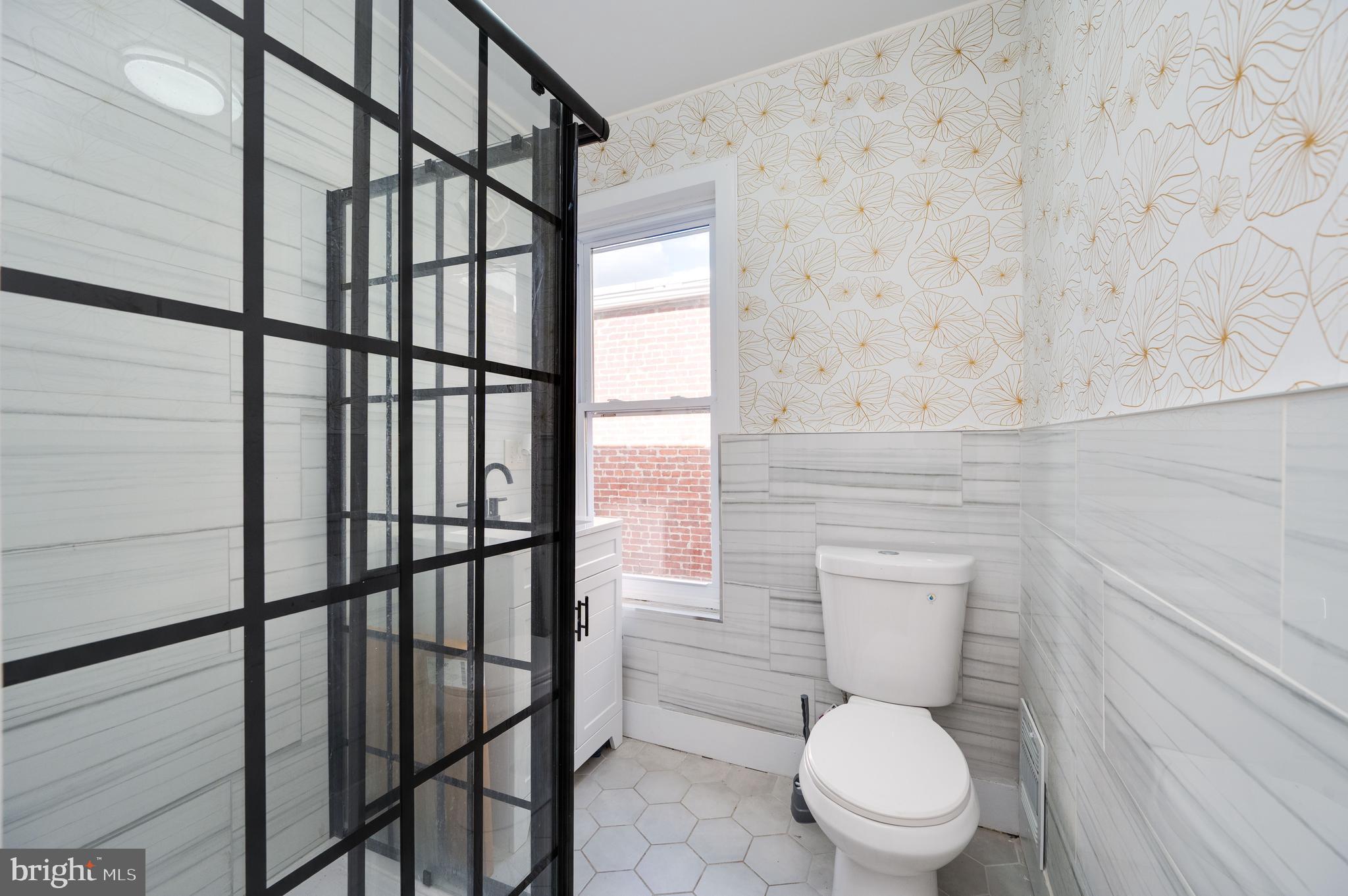 2024 Kutztown Road Reading, PA 19605 - Photo 25 of 38 a white toilet sitting next to a bathroom sink