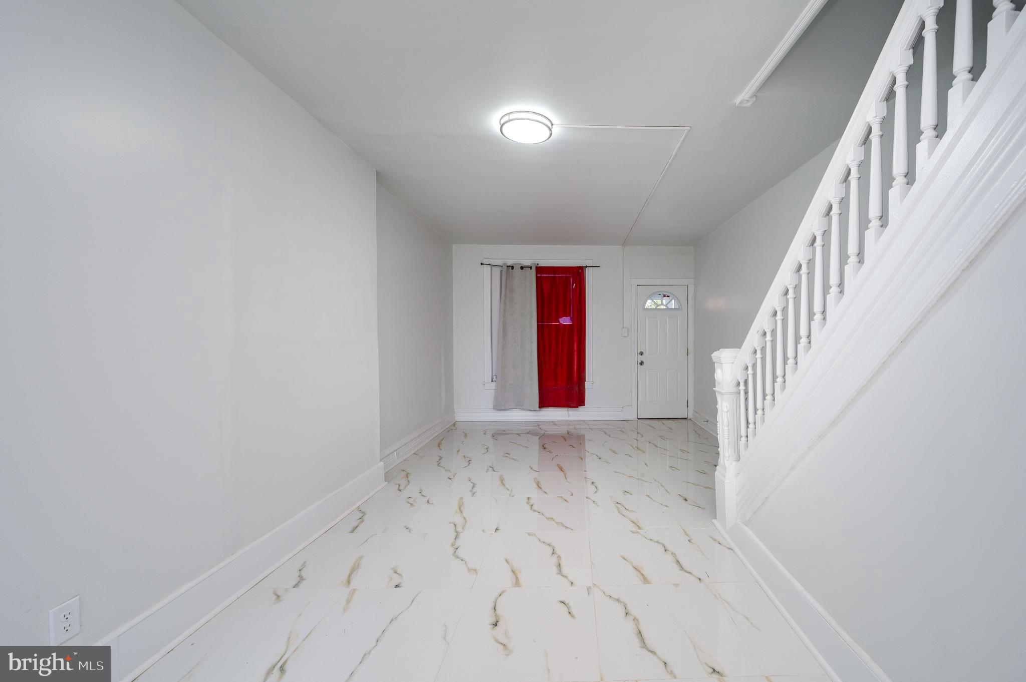 2024 Kutztown Road Reading, PA 19605 - Photo 4 of 38 a view of an empty room with wooden floor and stairs