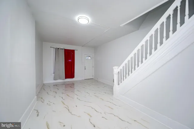 wooden floor in a hallway with a window
