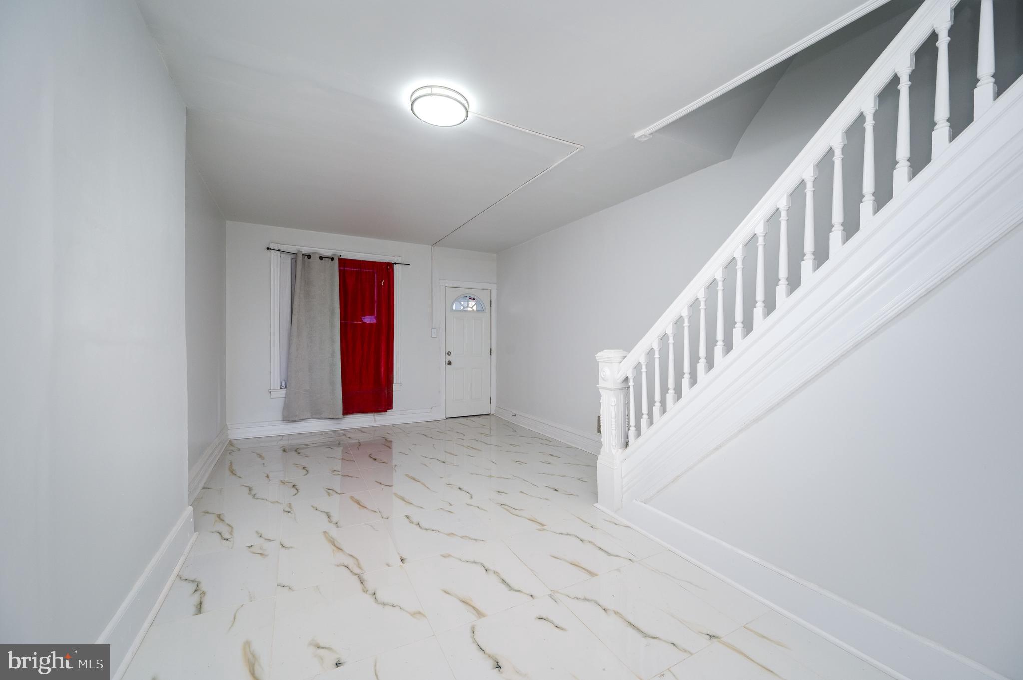 2024 Kutztown Road Reading, PA 19605 - Photo 5 of 38 wooden floor in a hallway with a window