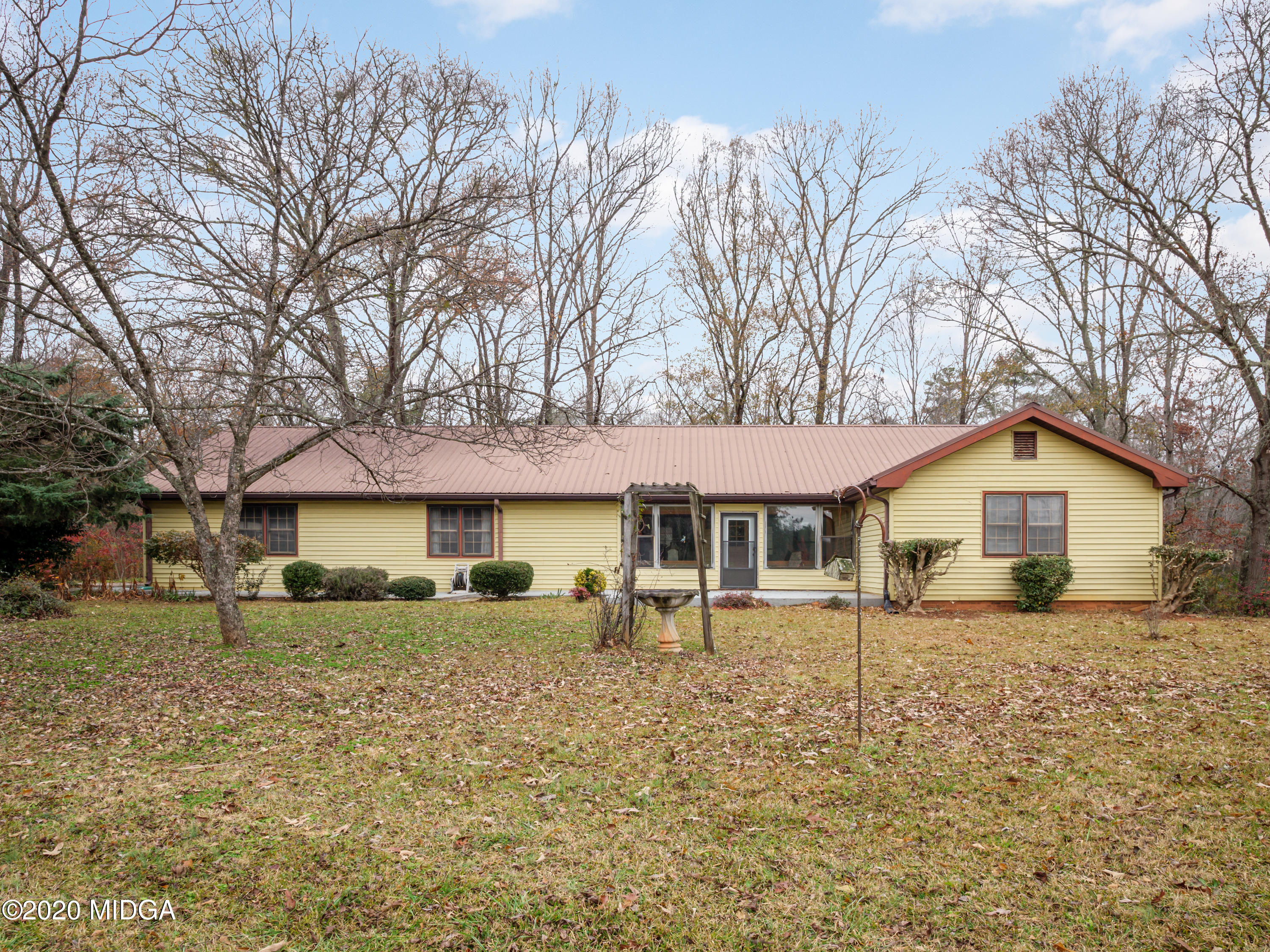 115 Hasty Road Jackson, GA 30233 - Photo 1 of 36 a white house that has a tree in front of it