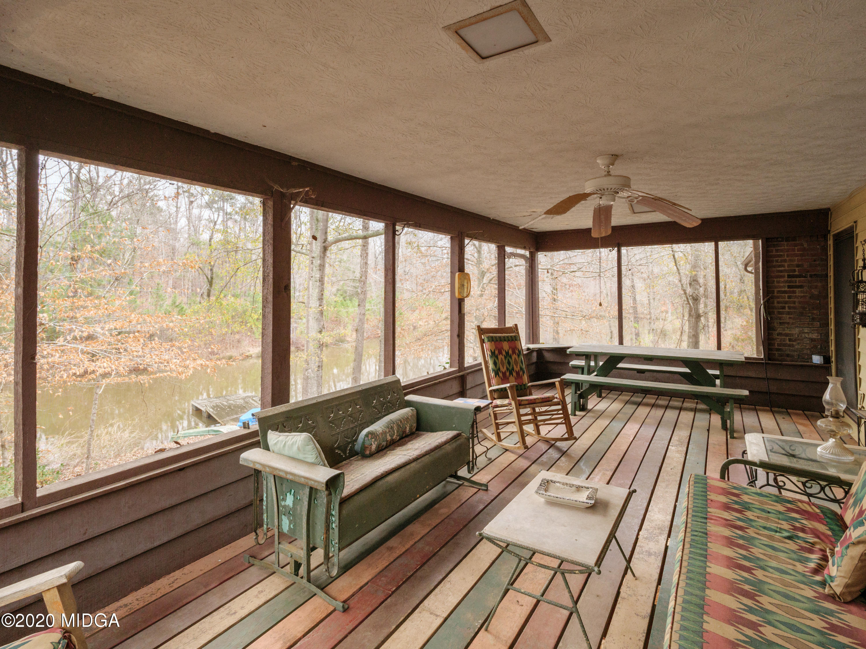 115 Hasty Road Jackson, GA 30233 - Photo 17 of 36 a living room with furniture and large windows
