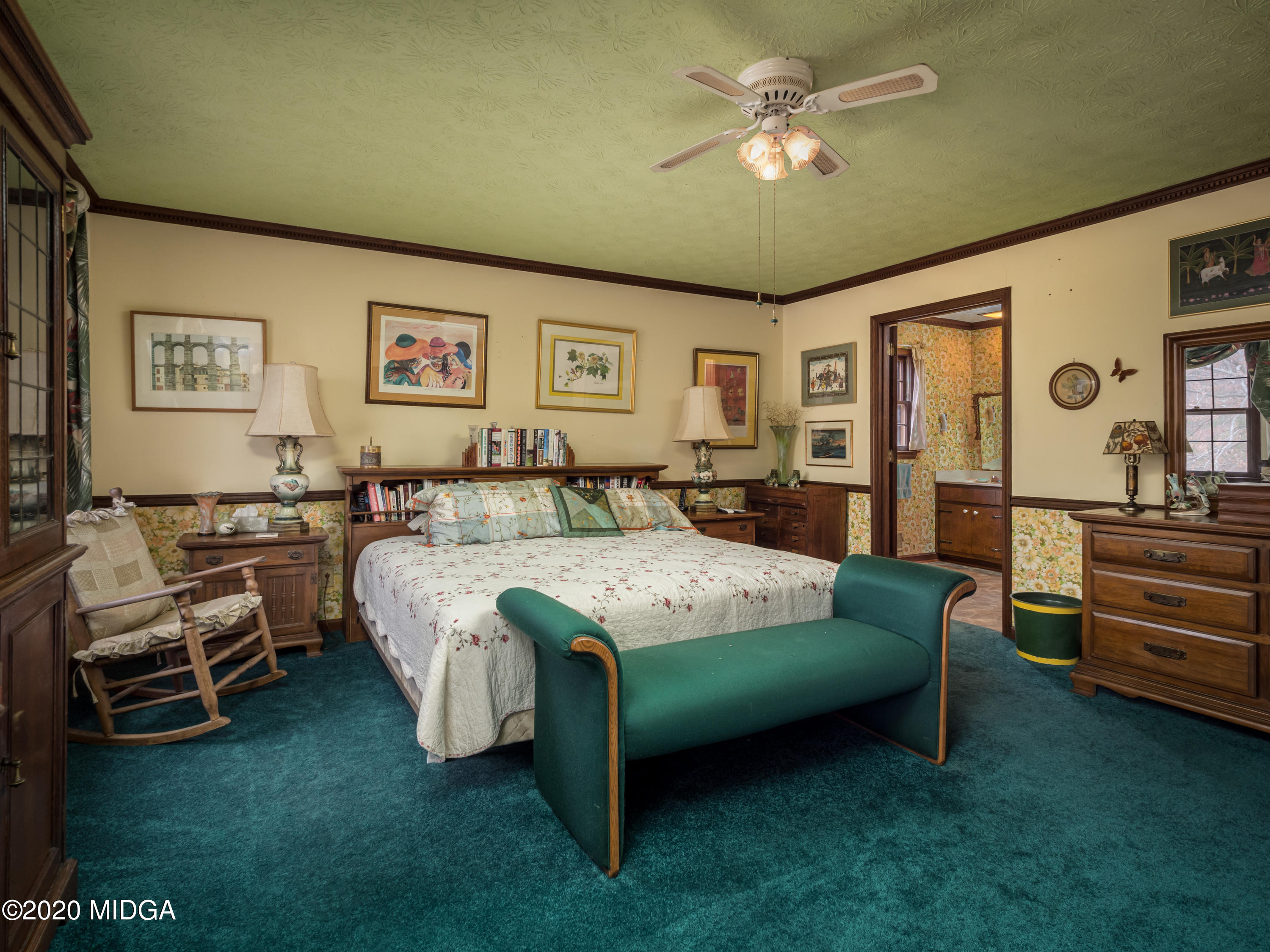 115 Hasty Road Jackson, GA 30233 - Photo 19 of 36 a bedroom with a bed and a chandelier