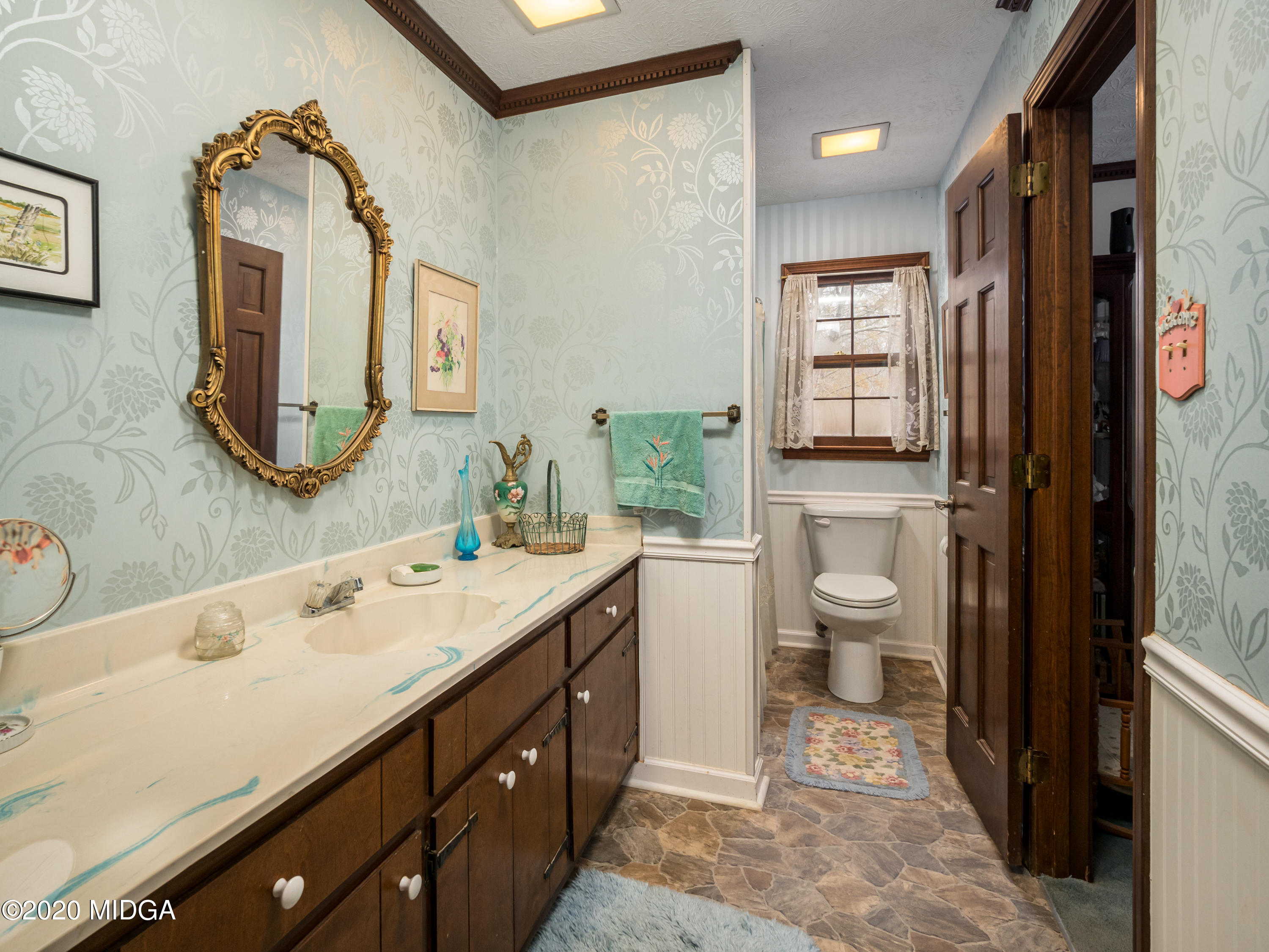 115 Hasty Road Jackson, GA 30233 - Photo 23 of 36 a spacious bathroom with a bathtub sink mirror and toilet