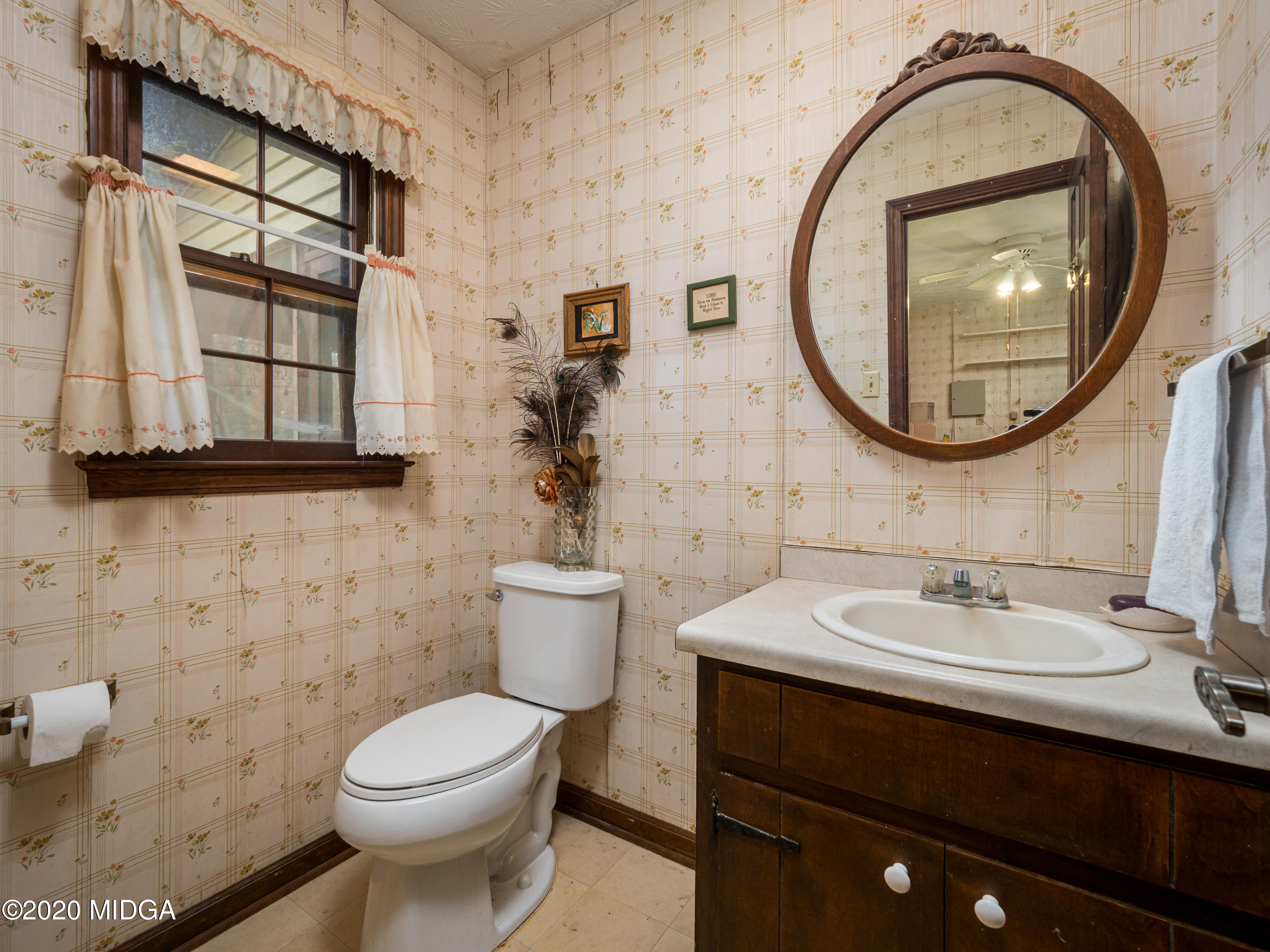115 Hasty Road Jackson, GA 30233 - Photo 25 of 36 a bathroom with a sink and a mirror