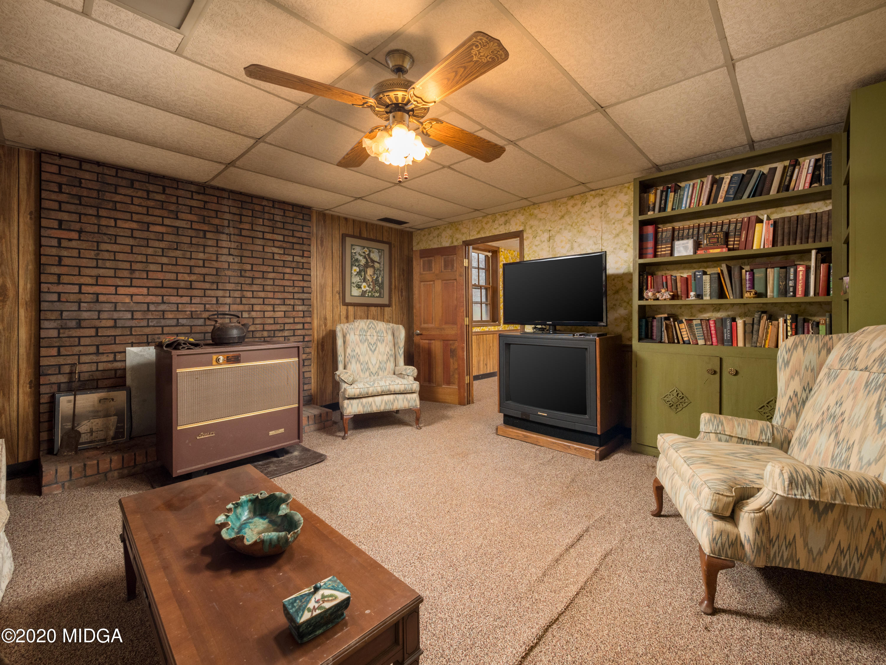 115 Hasty Road Jackson, GA 30233 - Photo 28 of 36 a living room with furniture and a flat screen tv