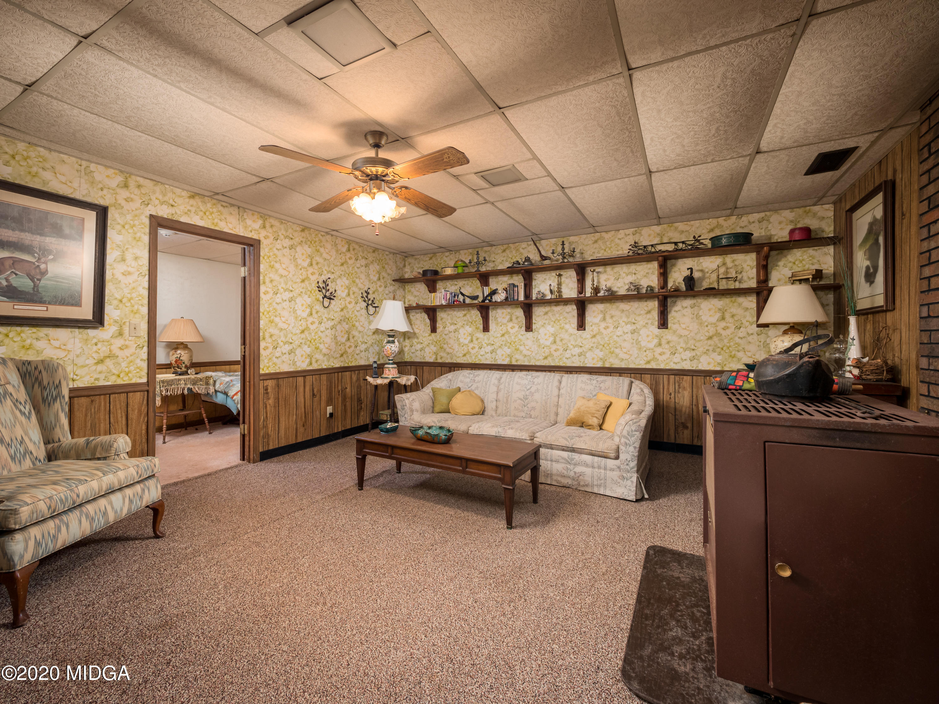 115 Hasty Road Jackson, GA 30233 - Photo 29 of 36 a living room with furniture and a chandelier