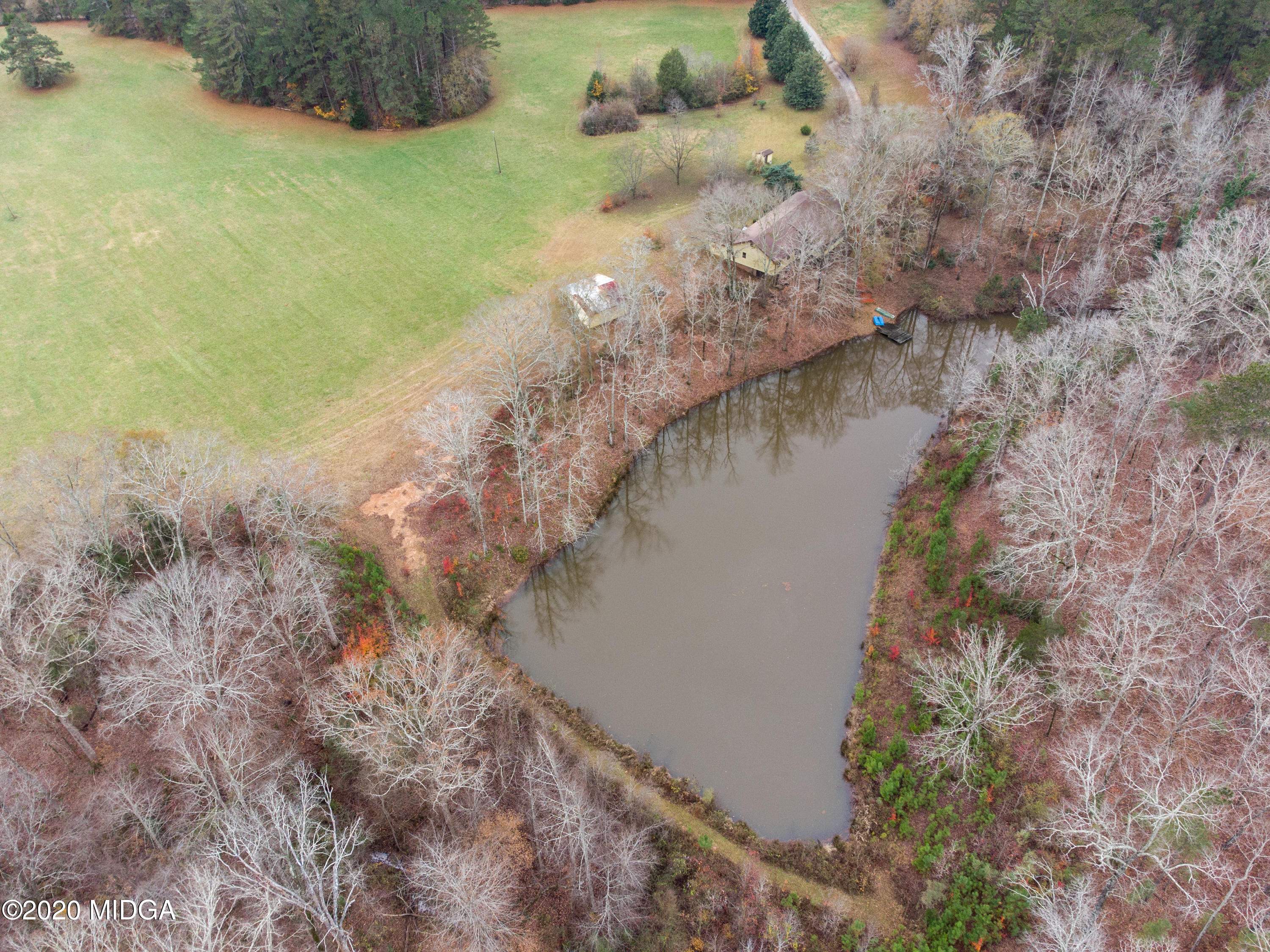 115 Hasty Road Jackson, GA 30233 - Photo 4 of 36 a view of a lake with large trees