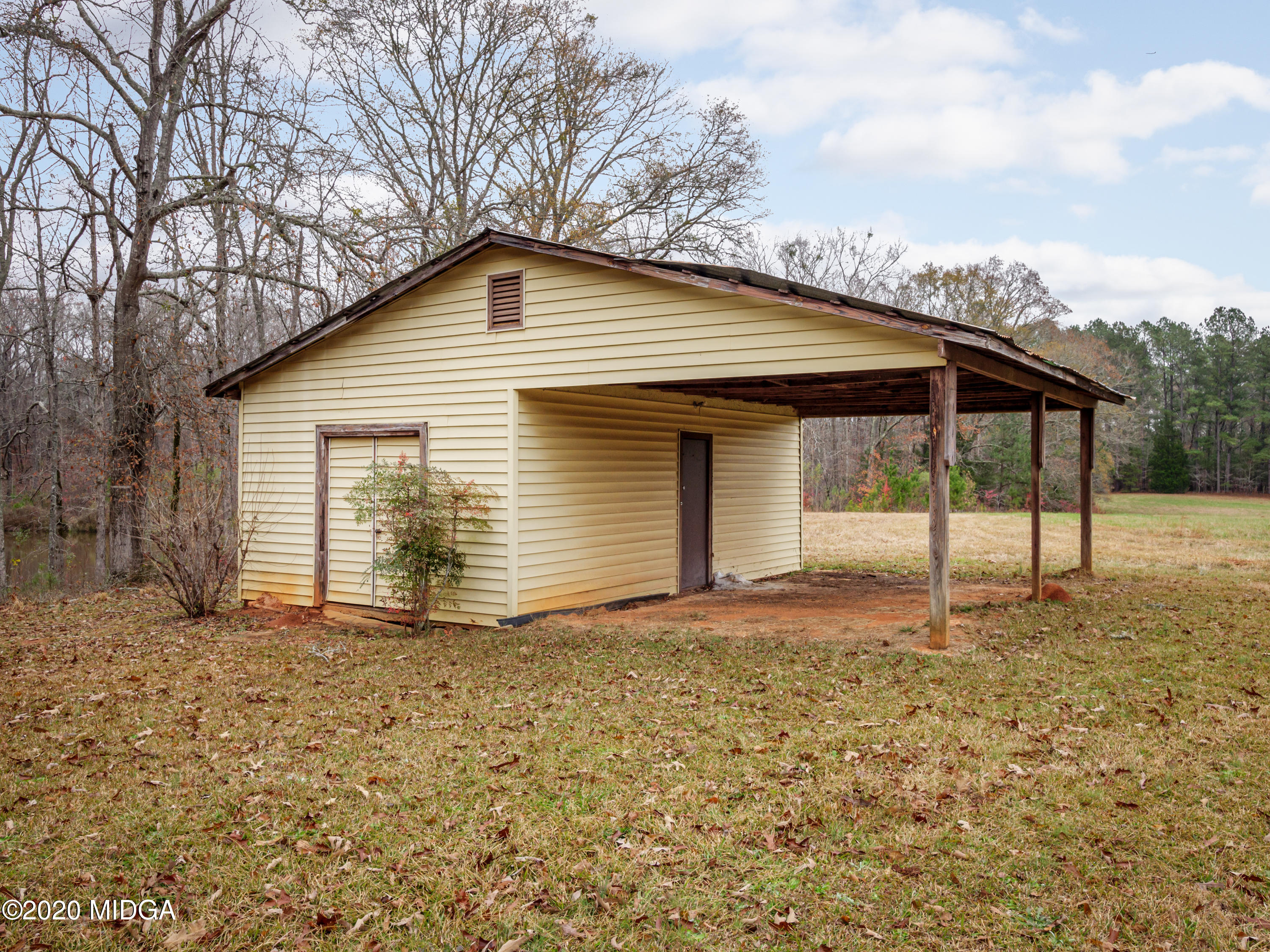 115 Hasty Road Jackson, GA 30233 - Photo 34 of 36 a house with trees in the background